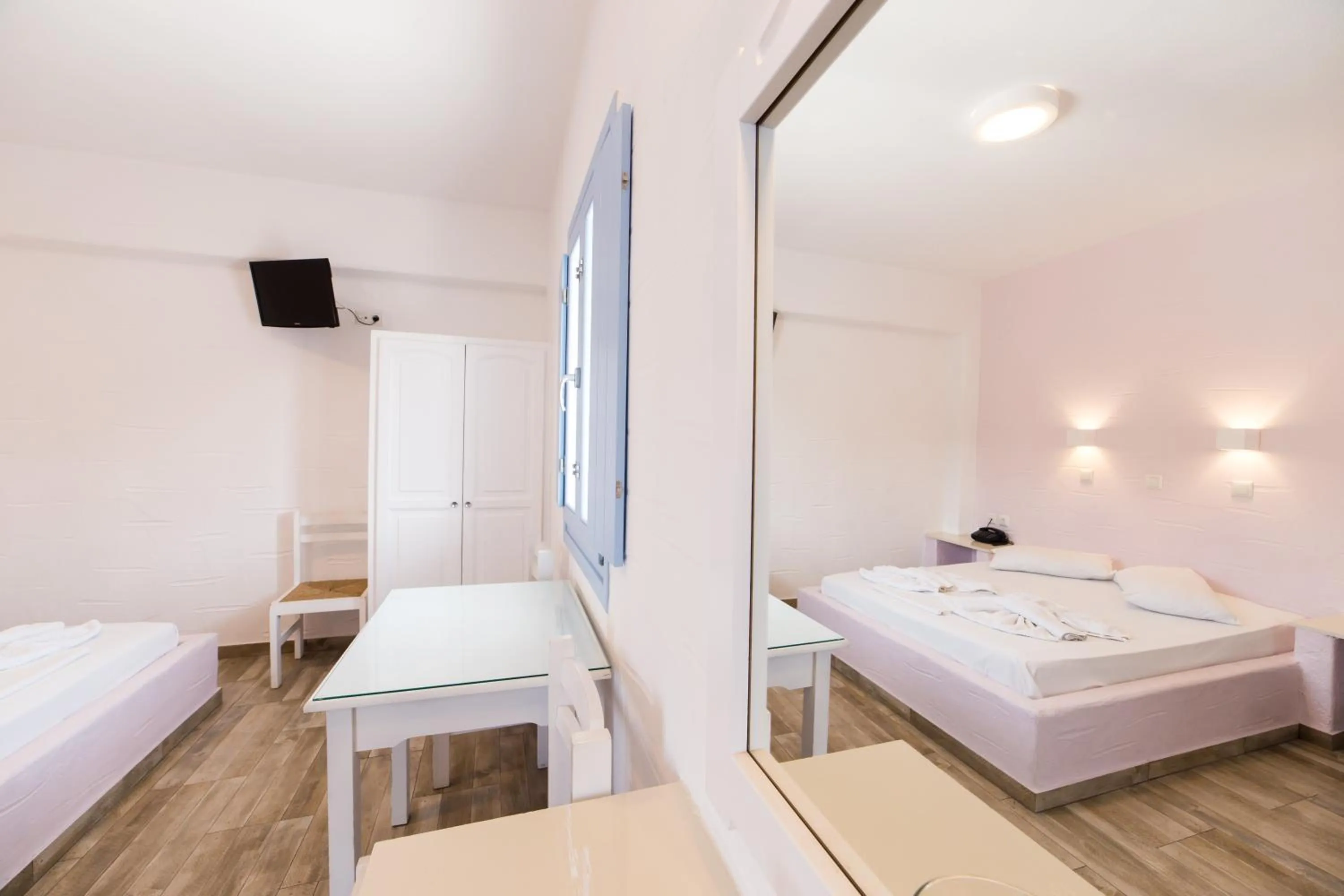 Bed in Stratos Apartments & Studios