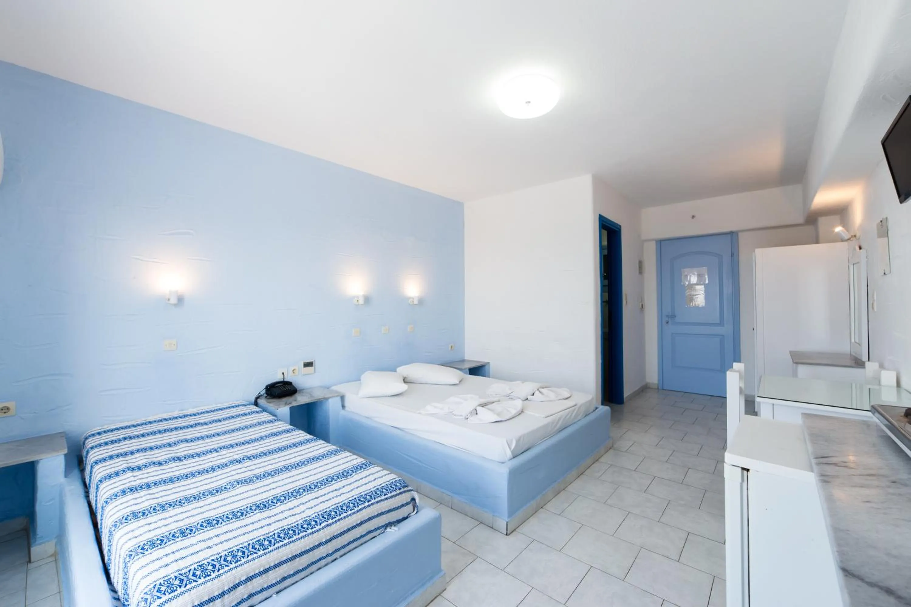 Bed in Stratos Apartments & Studios