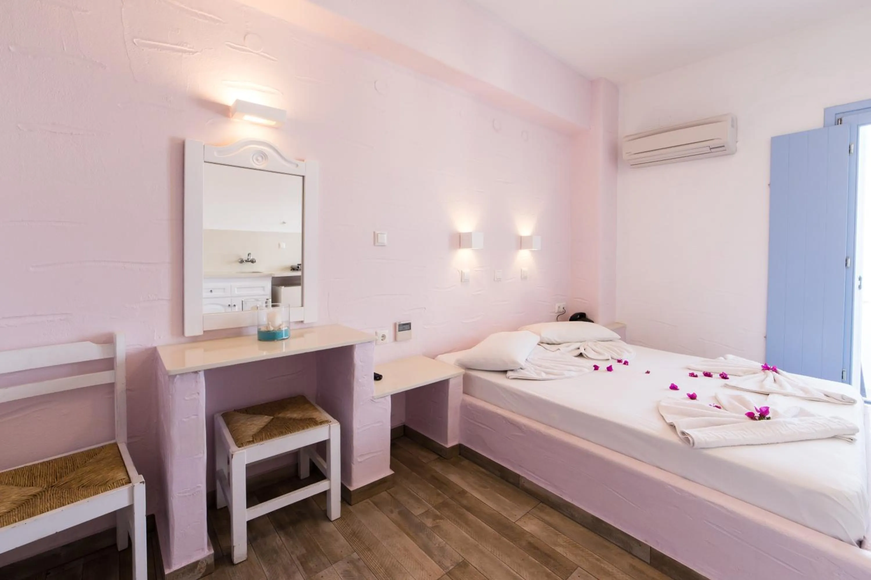 Bed in Stratos Apartments & Studios