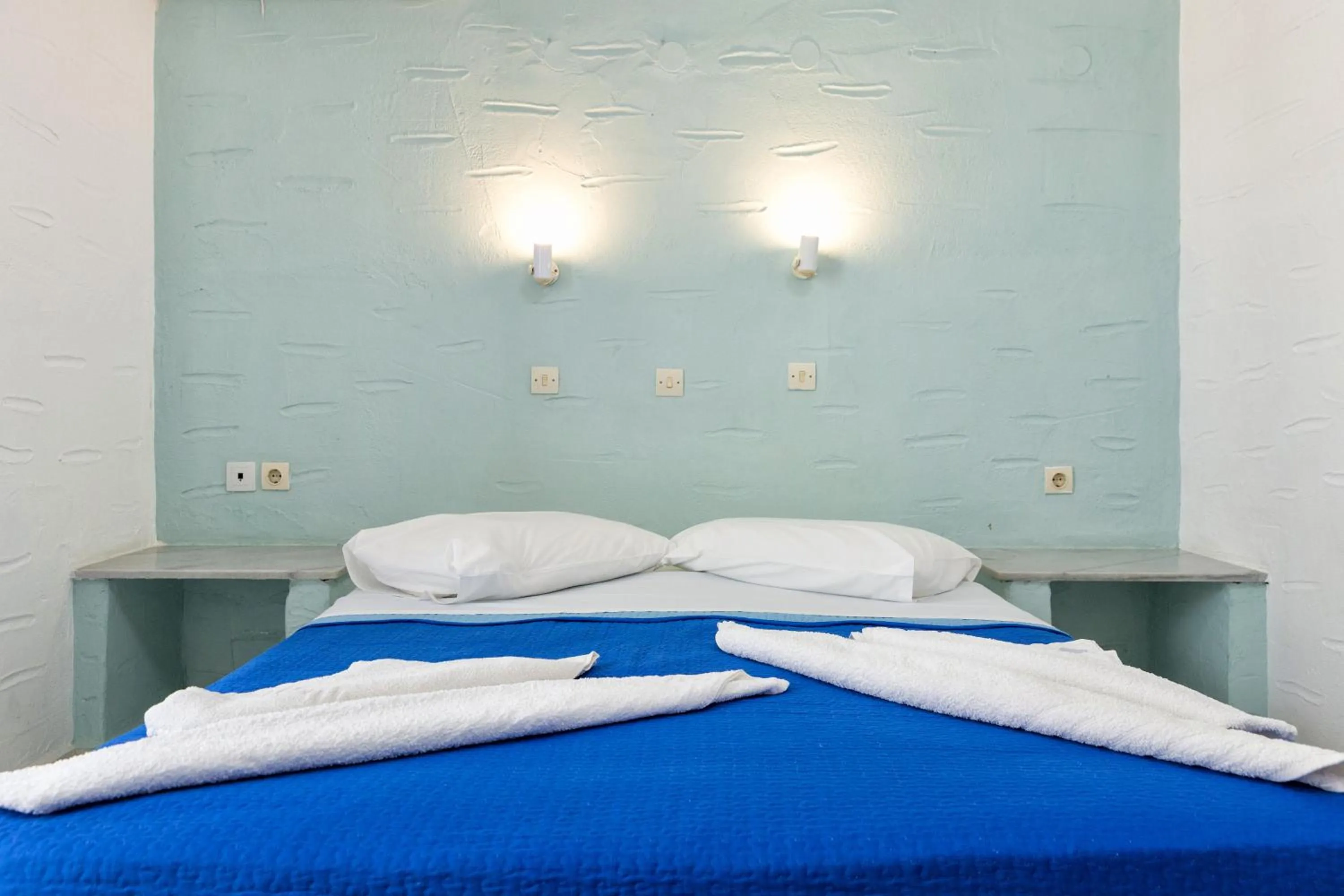 Bed in Stratos Apartments & Studios