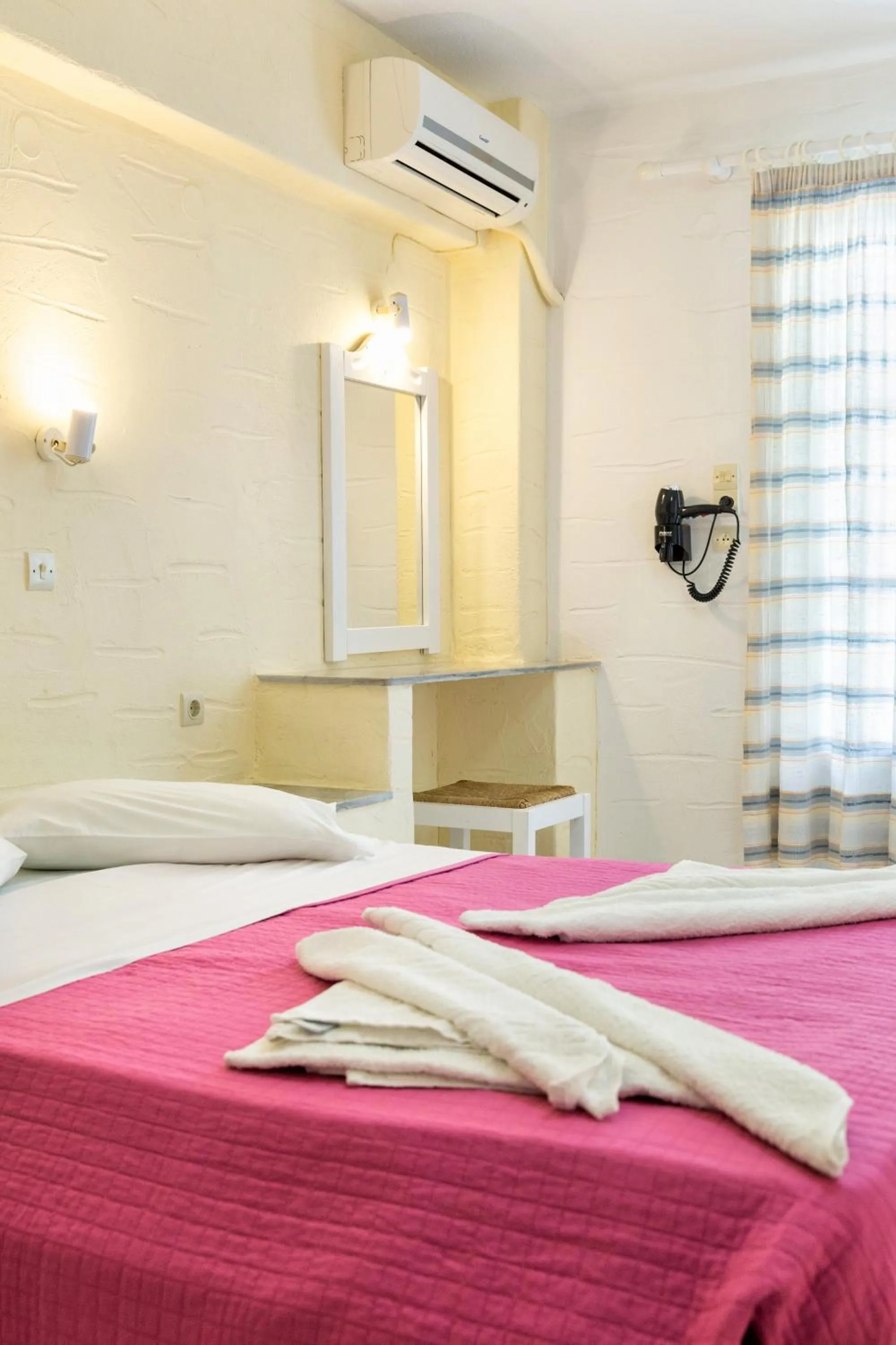 Bed in Stratos Apartments & Studios