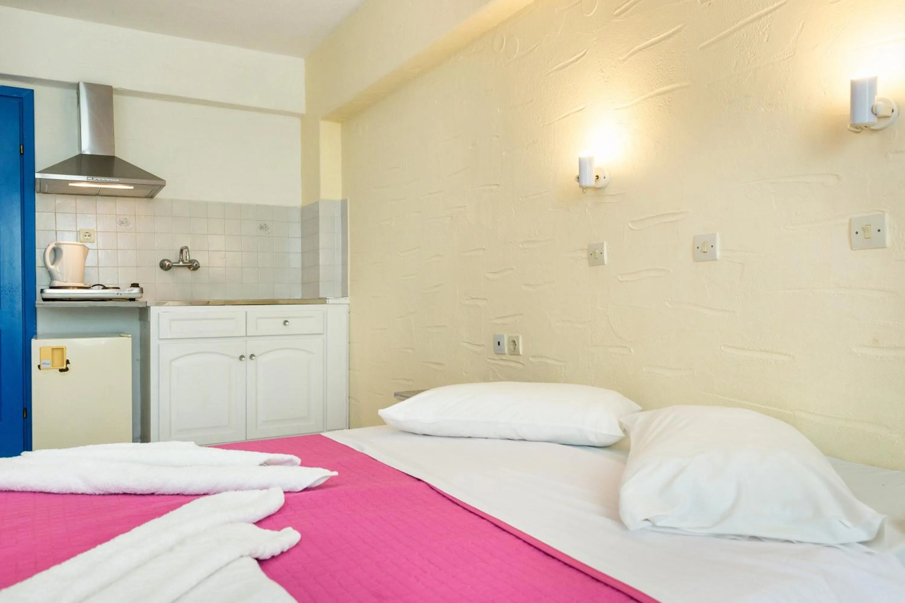 Bed in Stratos Apartments & Studios