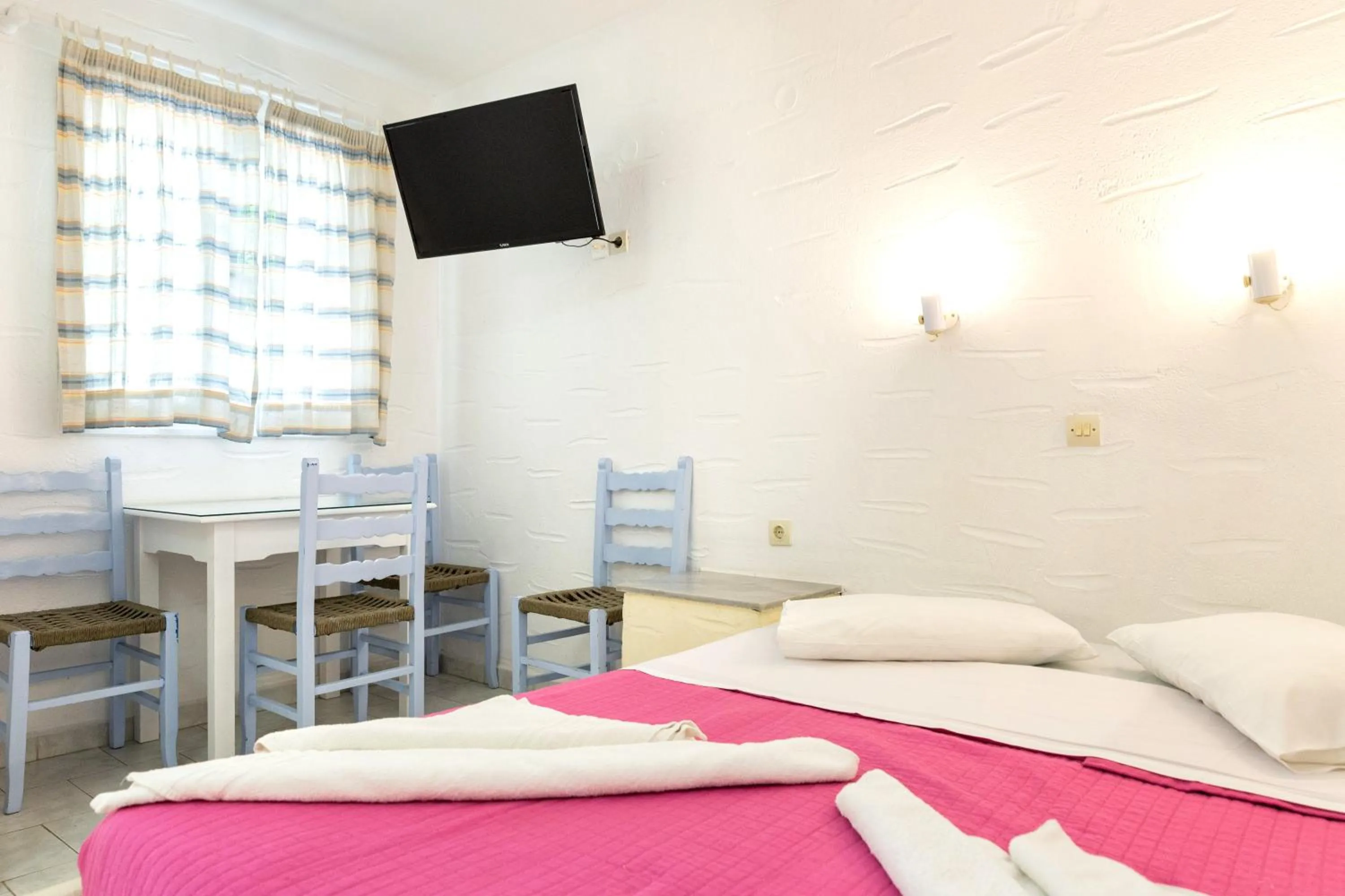 Bed in Stratos Apartments & Studios