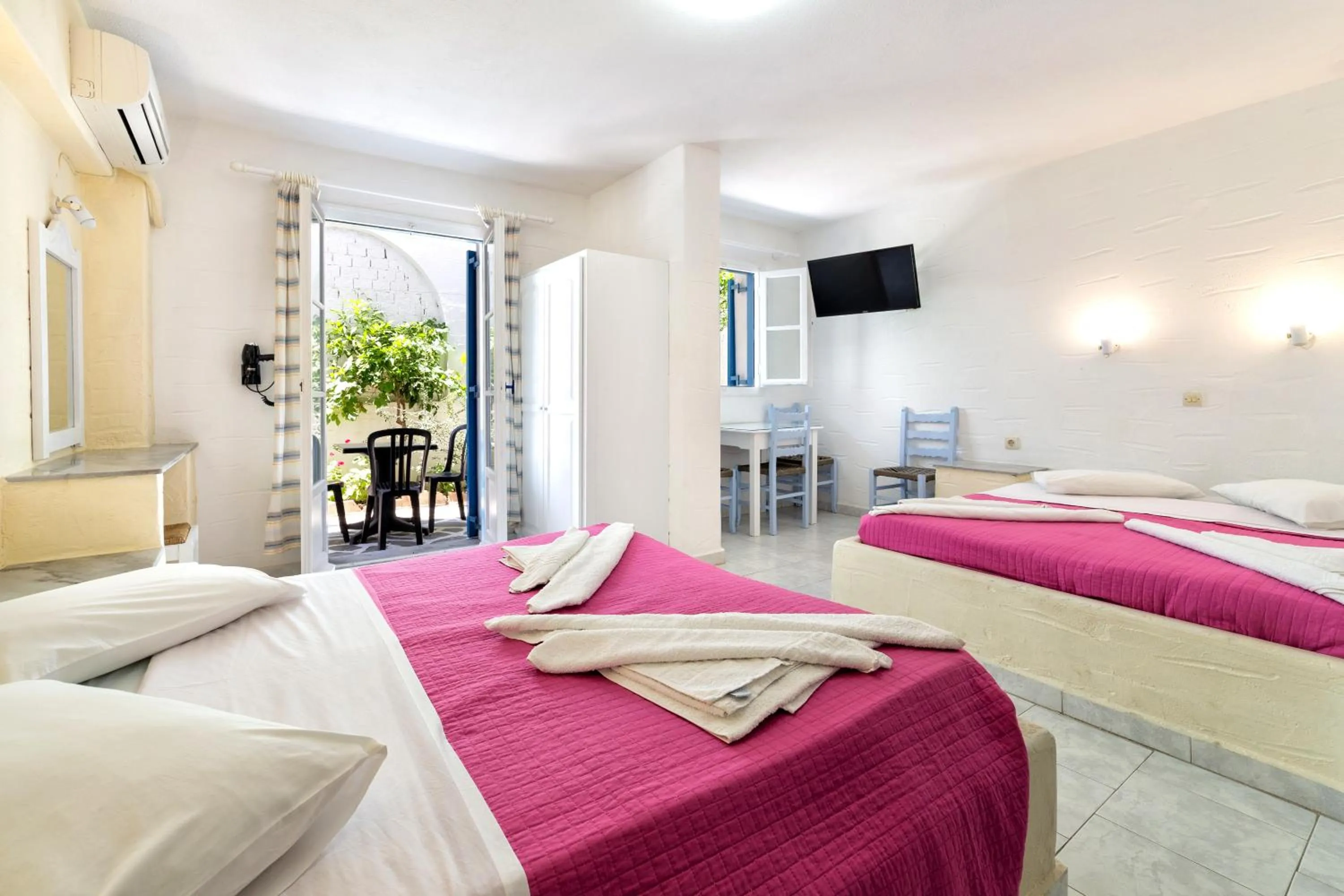 Bed in Stratos Apartments & Studios