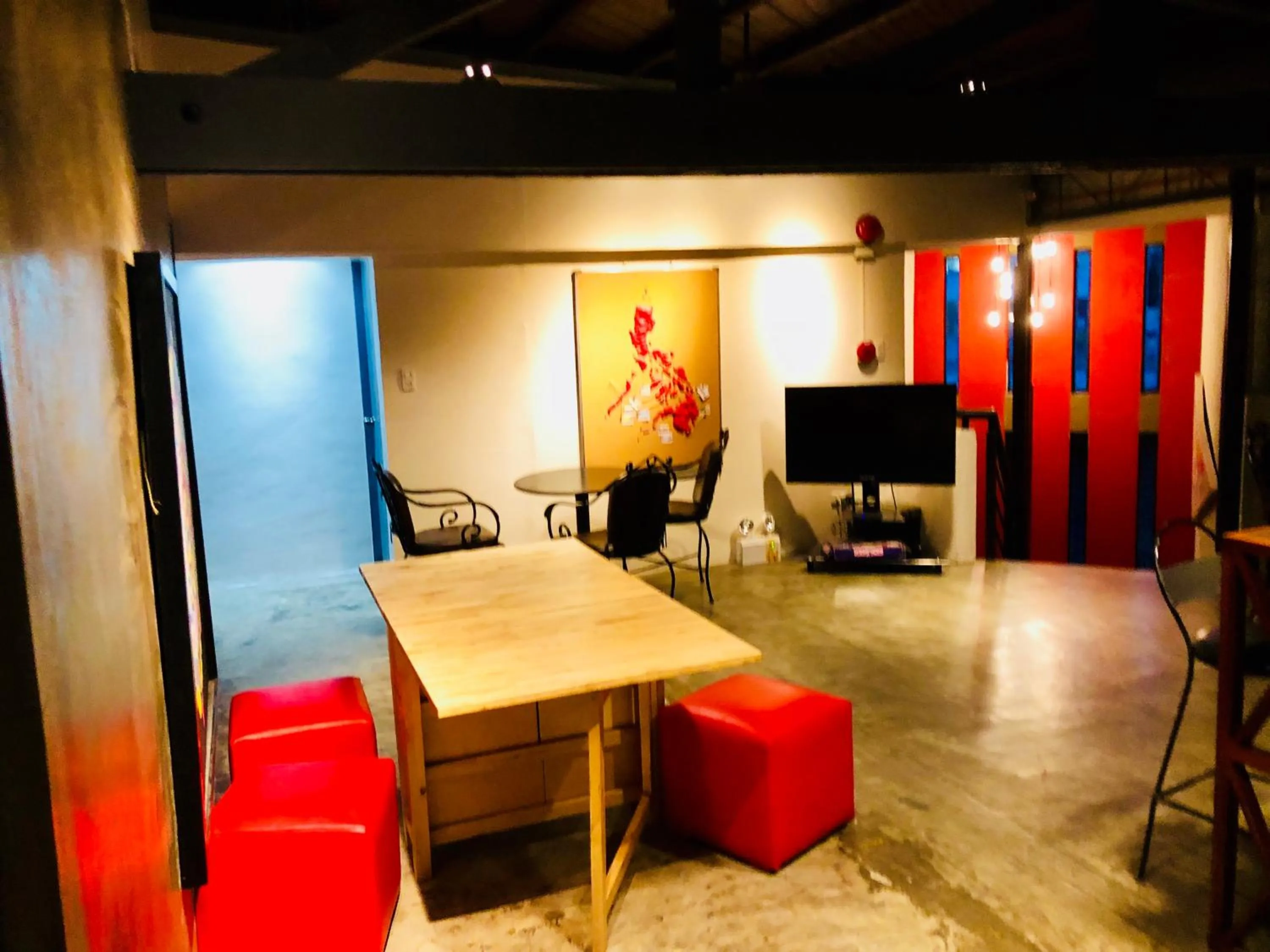 Communal lounge/ TV room in Hometown Hotel - Lacson Bacolod