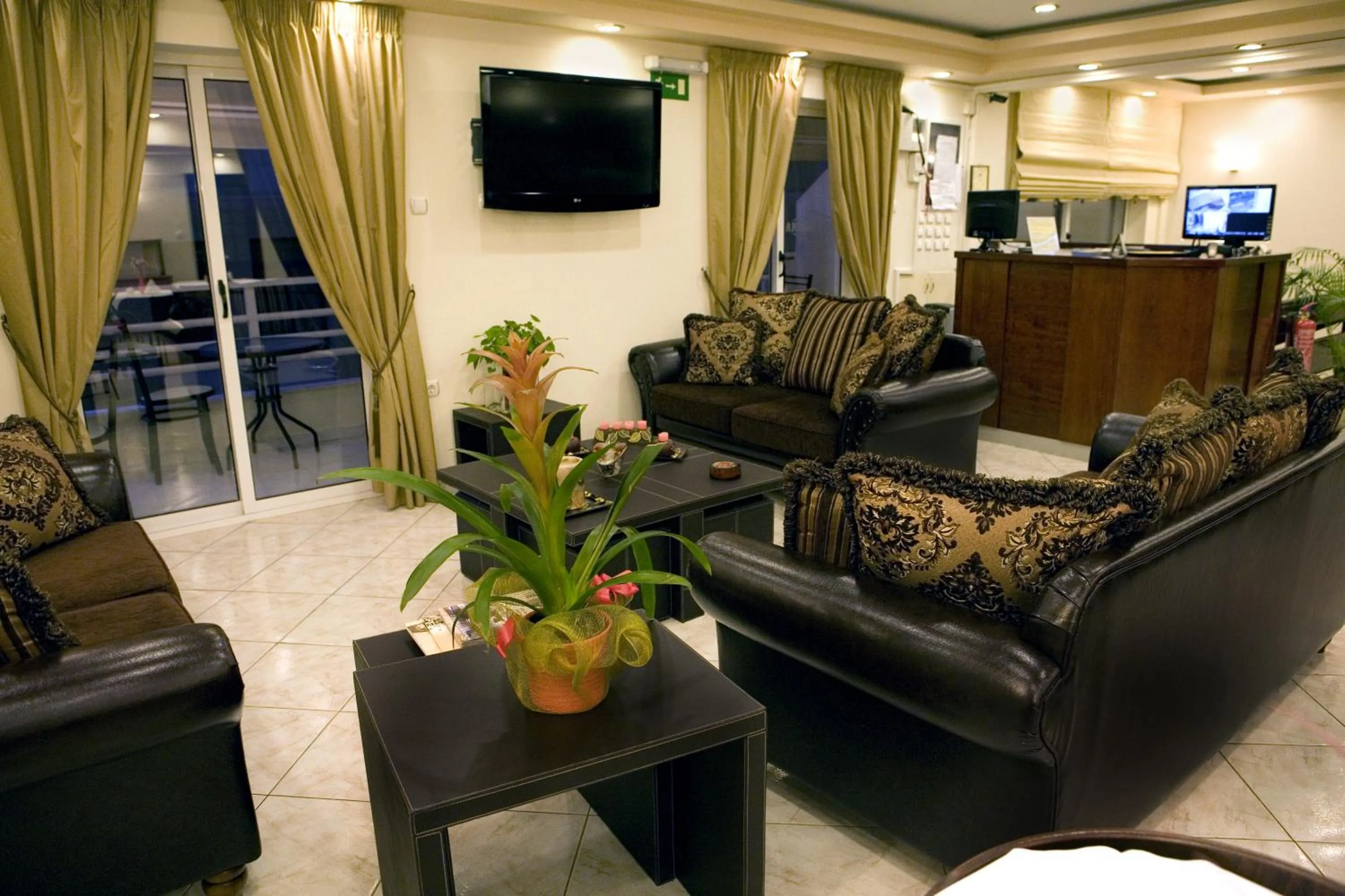 Communal lounge/ TV room in Archontiki City Hotel