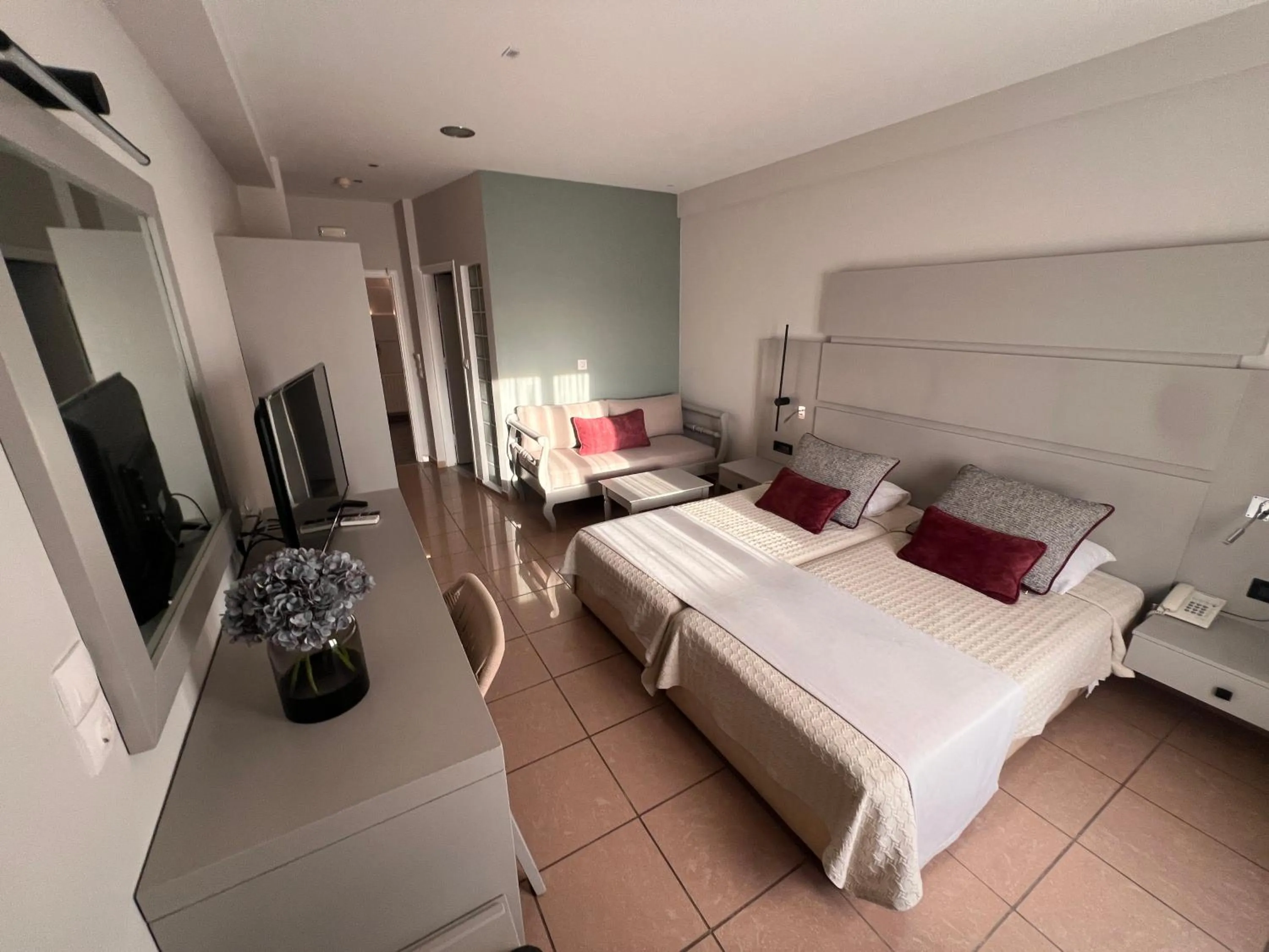 Bed in Theoxenia Caldera Hotel