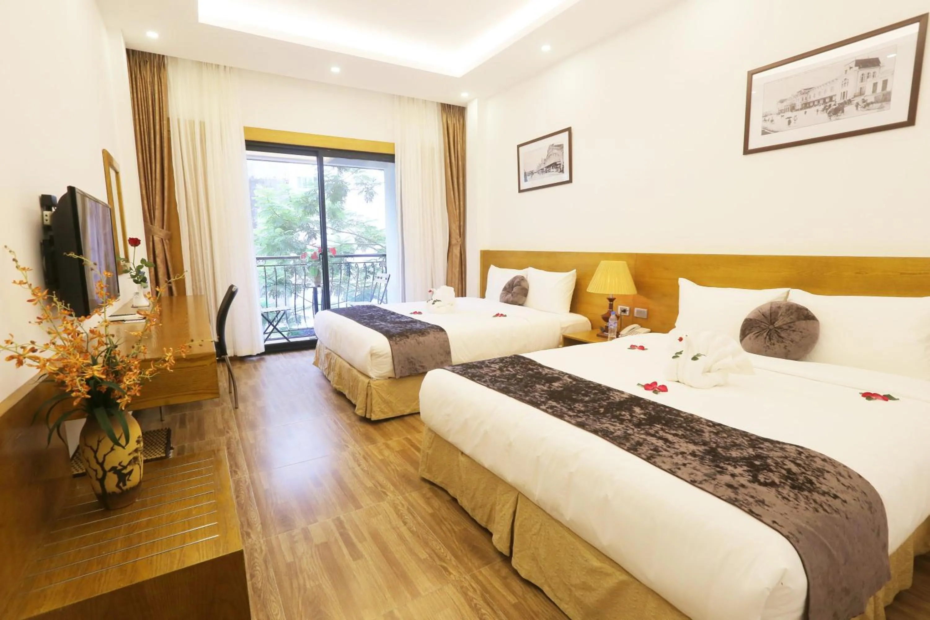 Bed in Family Hanoi Hotel