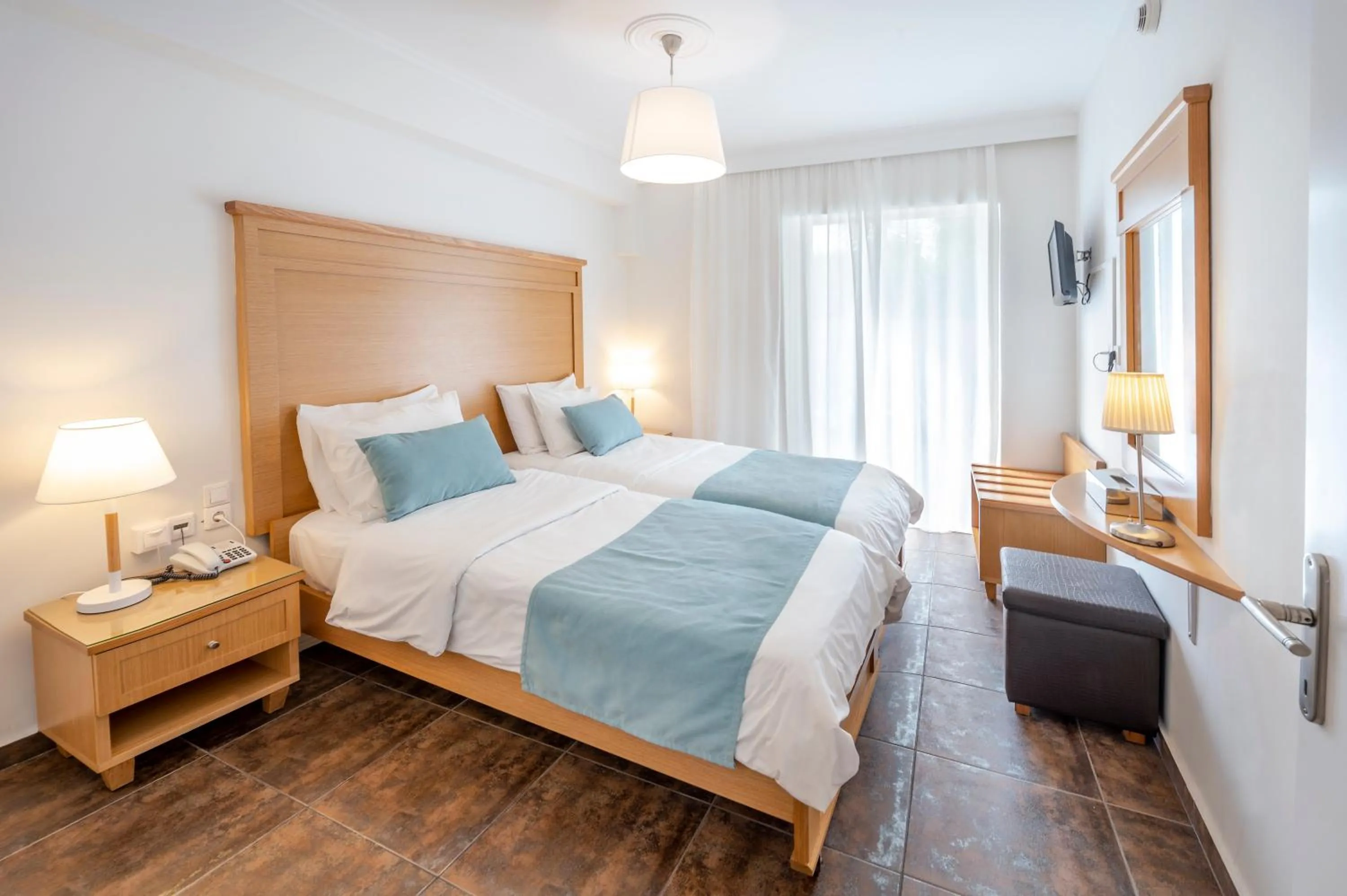 Bed in Peridis Family Resort