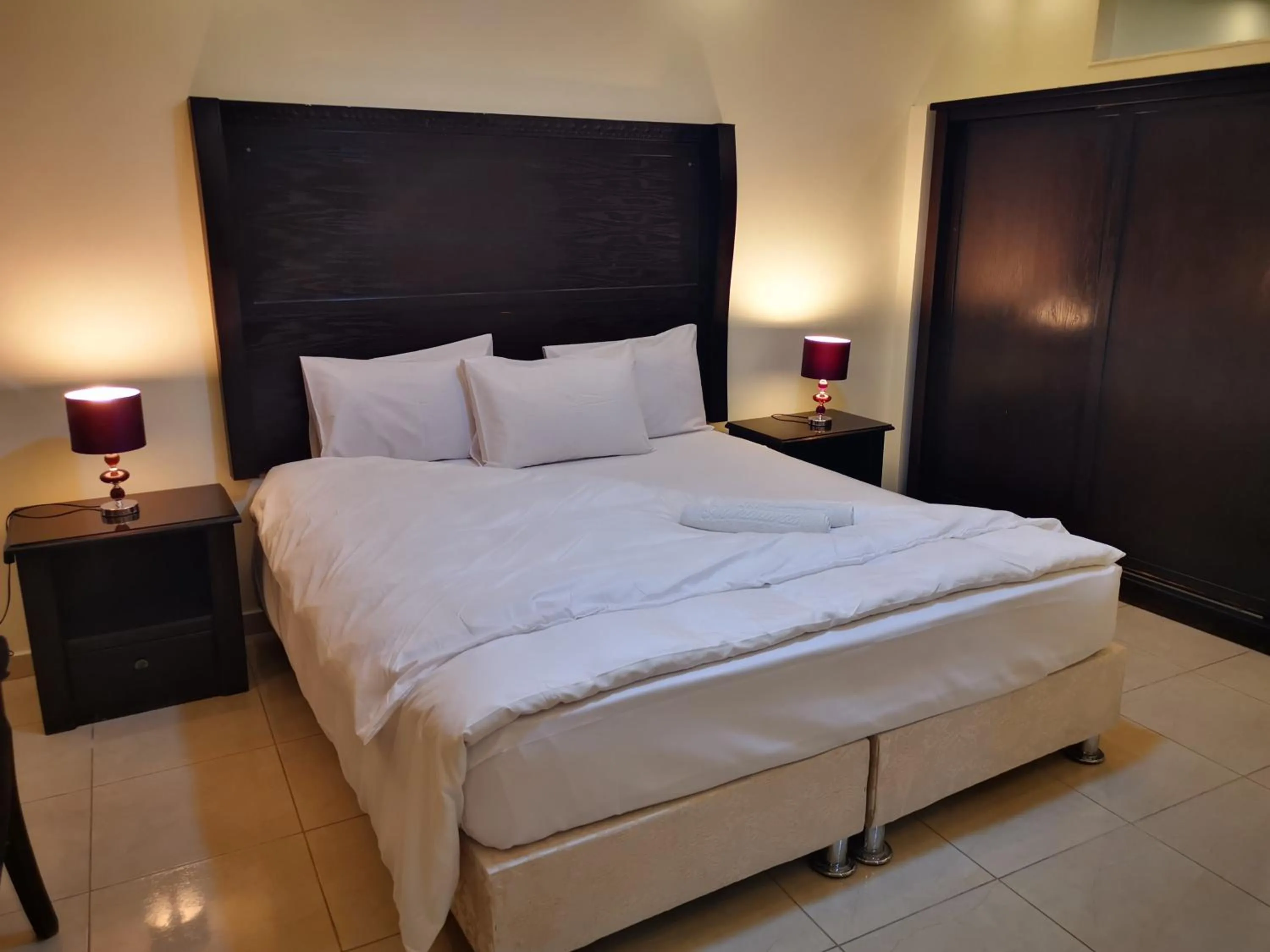 Bed in Al Fakher Hotel Apartments & Suites