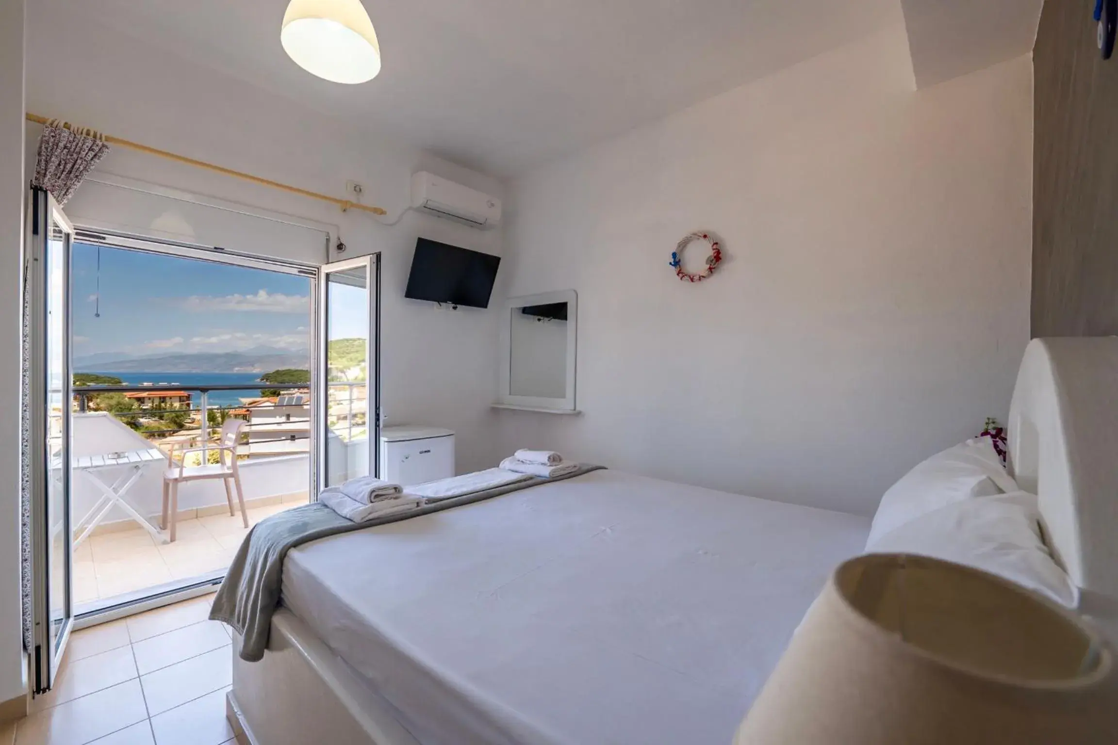 Deluxe Double Room with Balcony and Sea View in Hotel Two Mermaids Ksamil Deluxe Double Room with Balcony and Sea View in Hotel Two Mermaids Ksamil