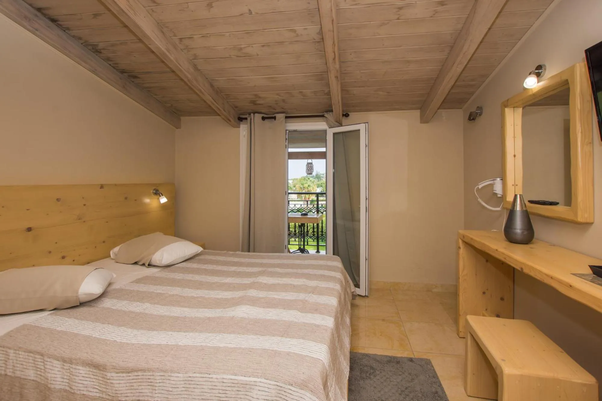 Photo of the whole room, Bed in Iniohos Zante Hotel & Suites