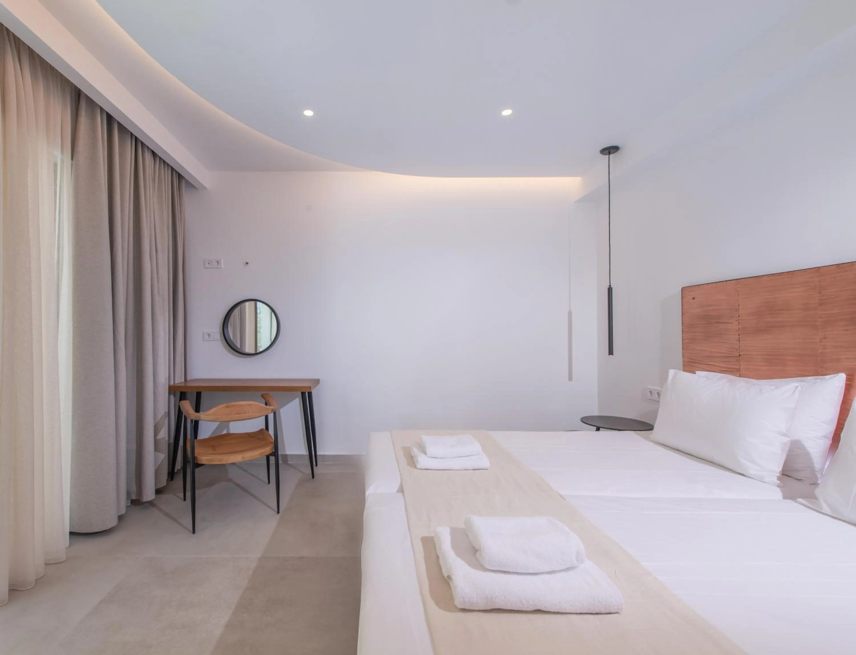 Bed in Mika Villas & Suites