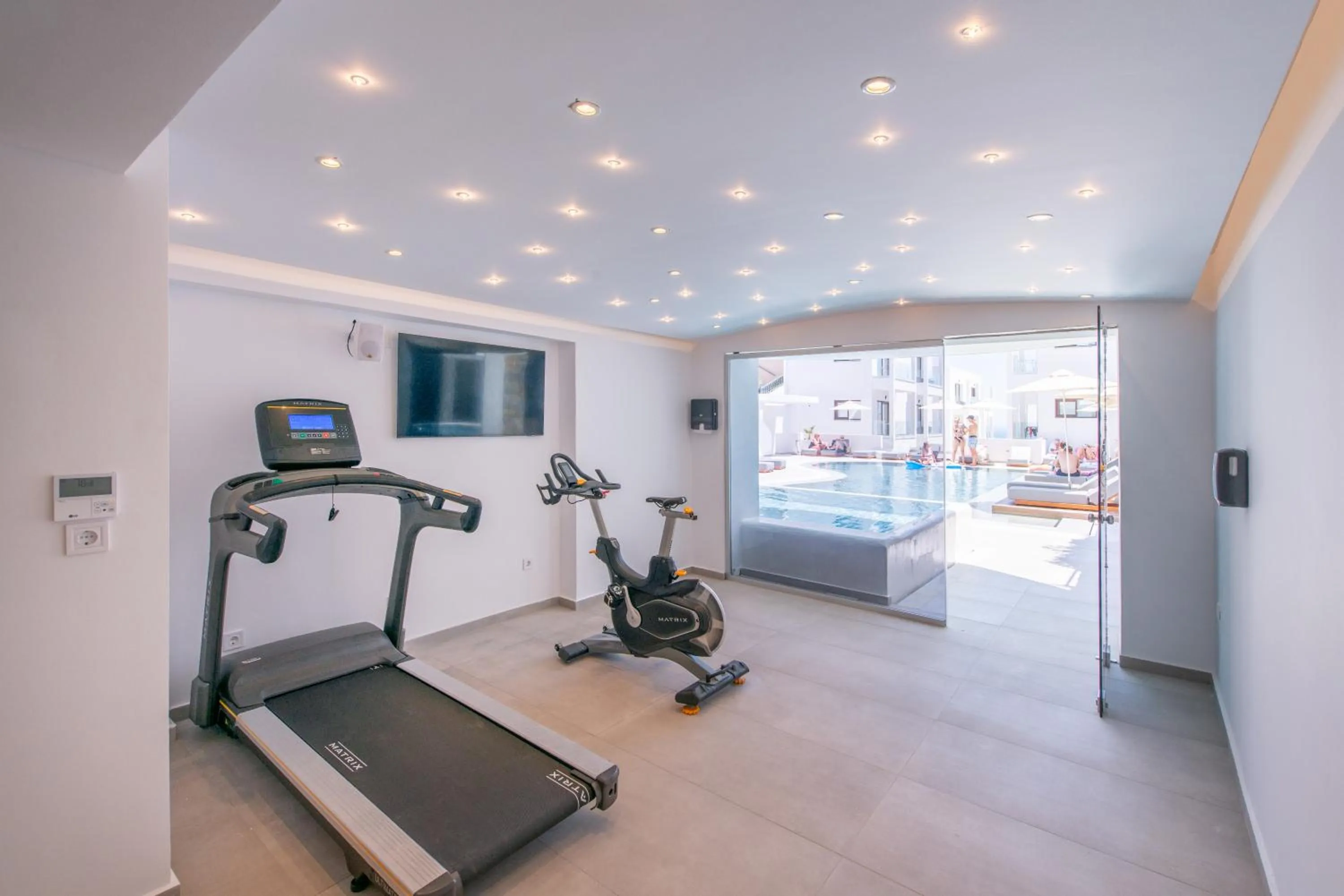 Communal lounge/ TV room in Mika Villas & Suites