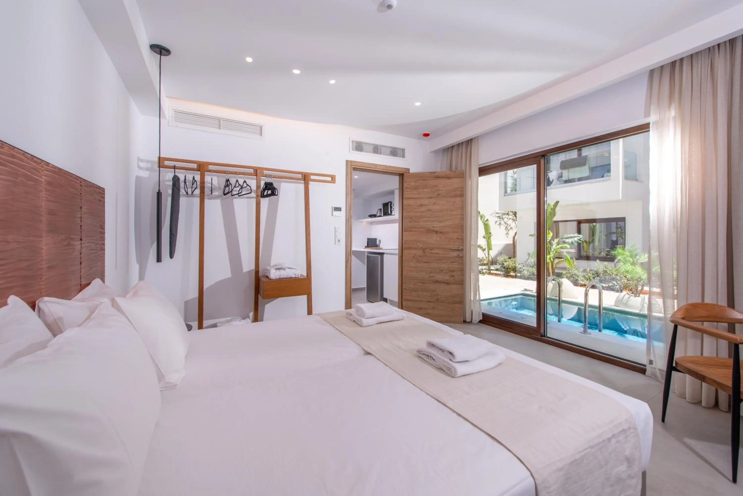 Bed in Mika Villas & Suites