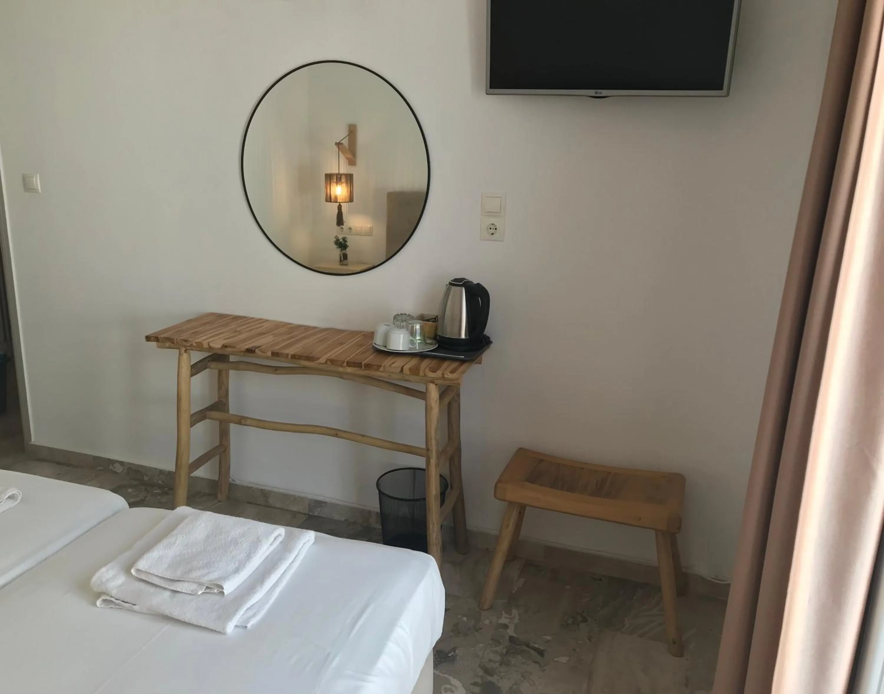 Bed in Vassiliki Rooms