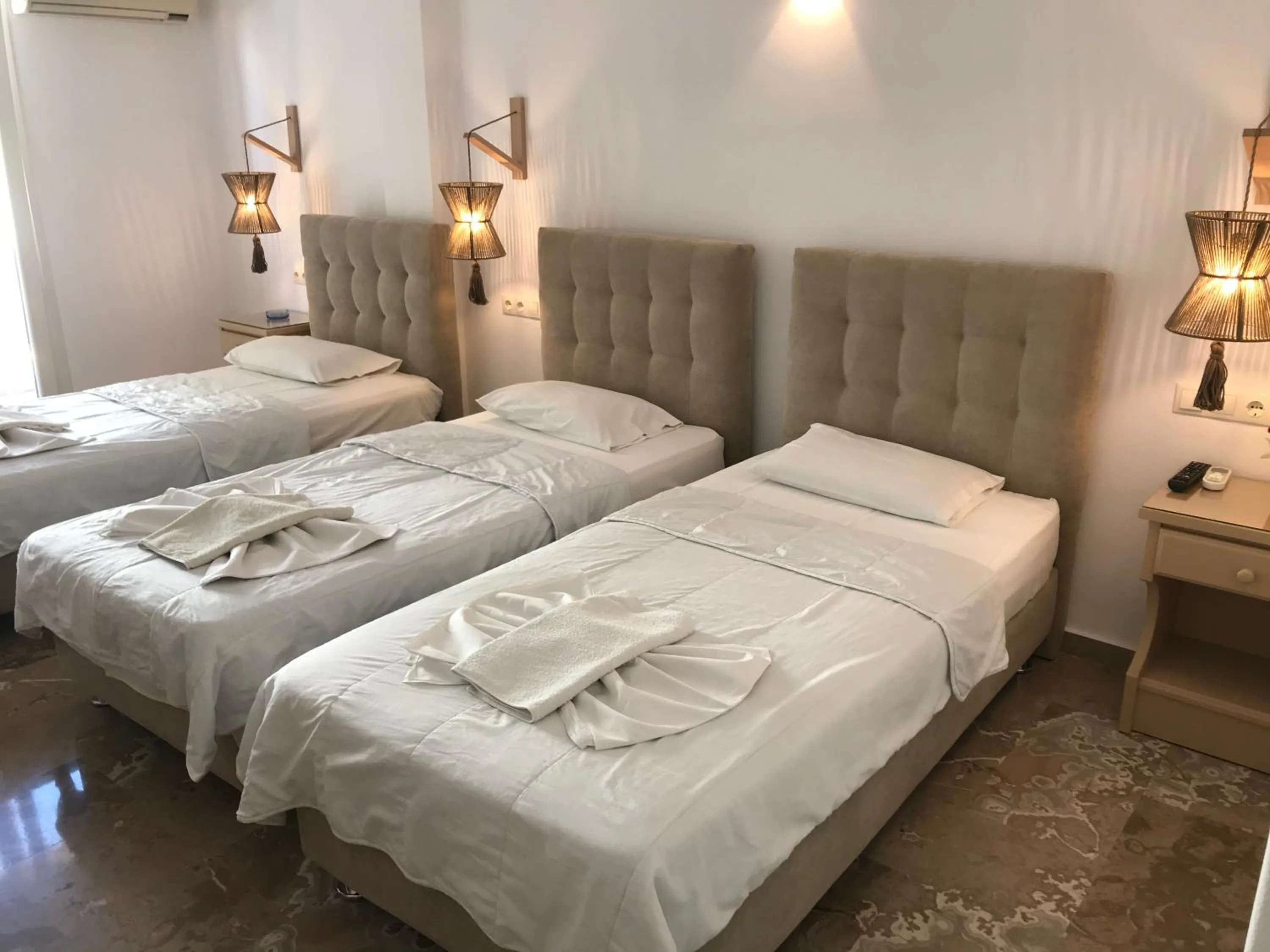 Bed in Vassiliki Rooms