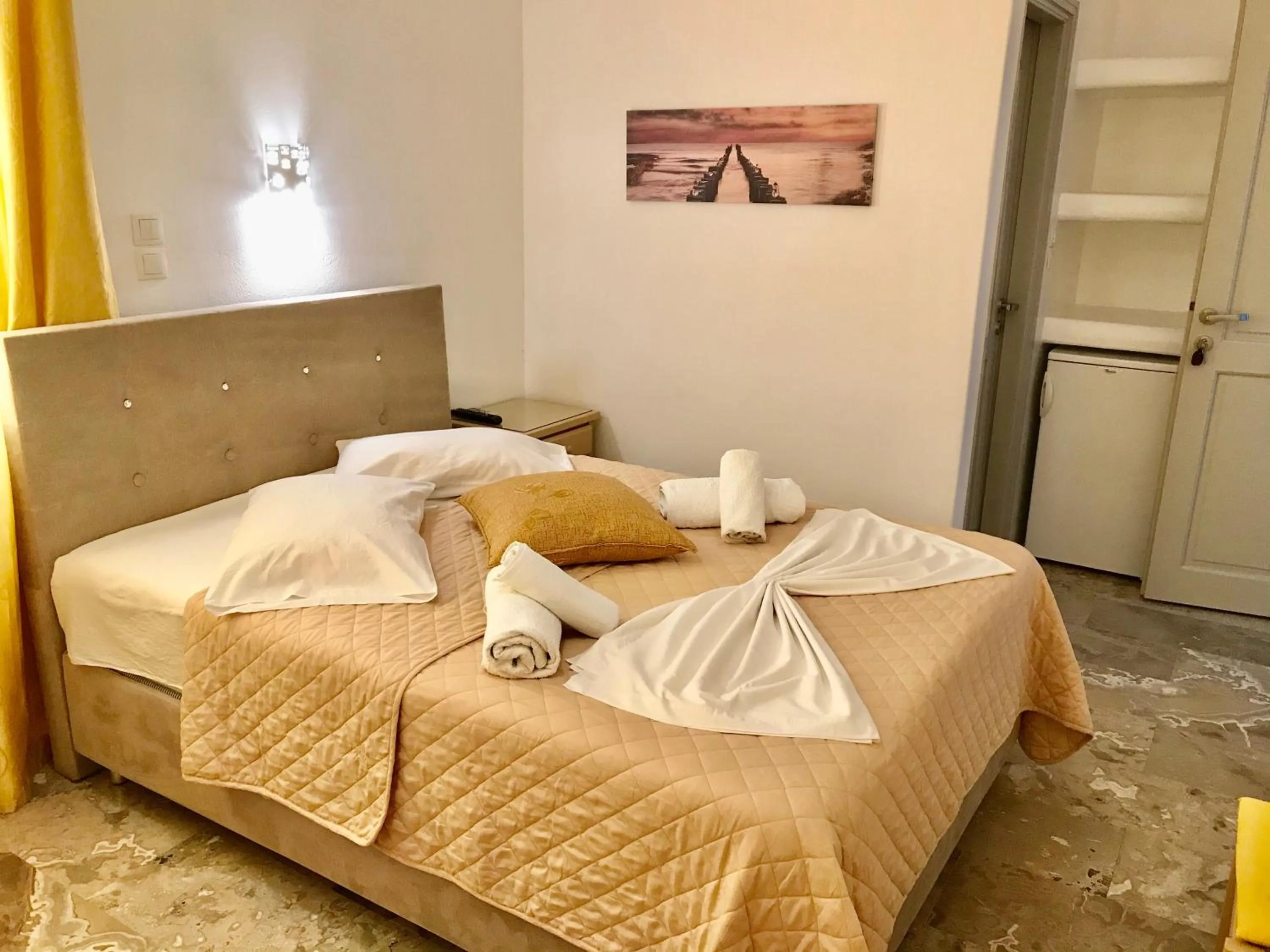 Bed in Vassiliki Rooms
