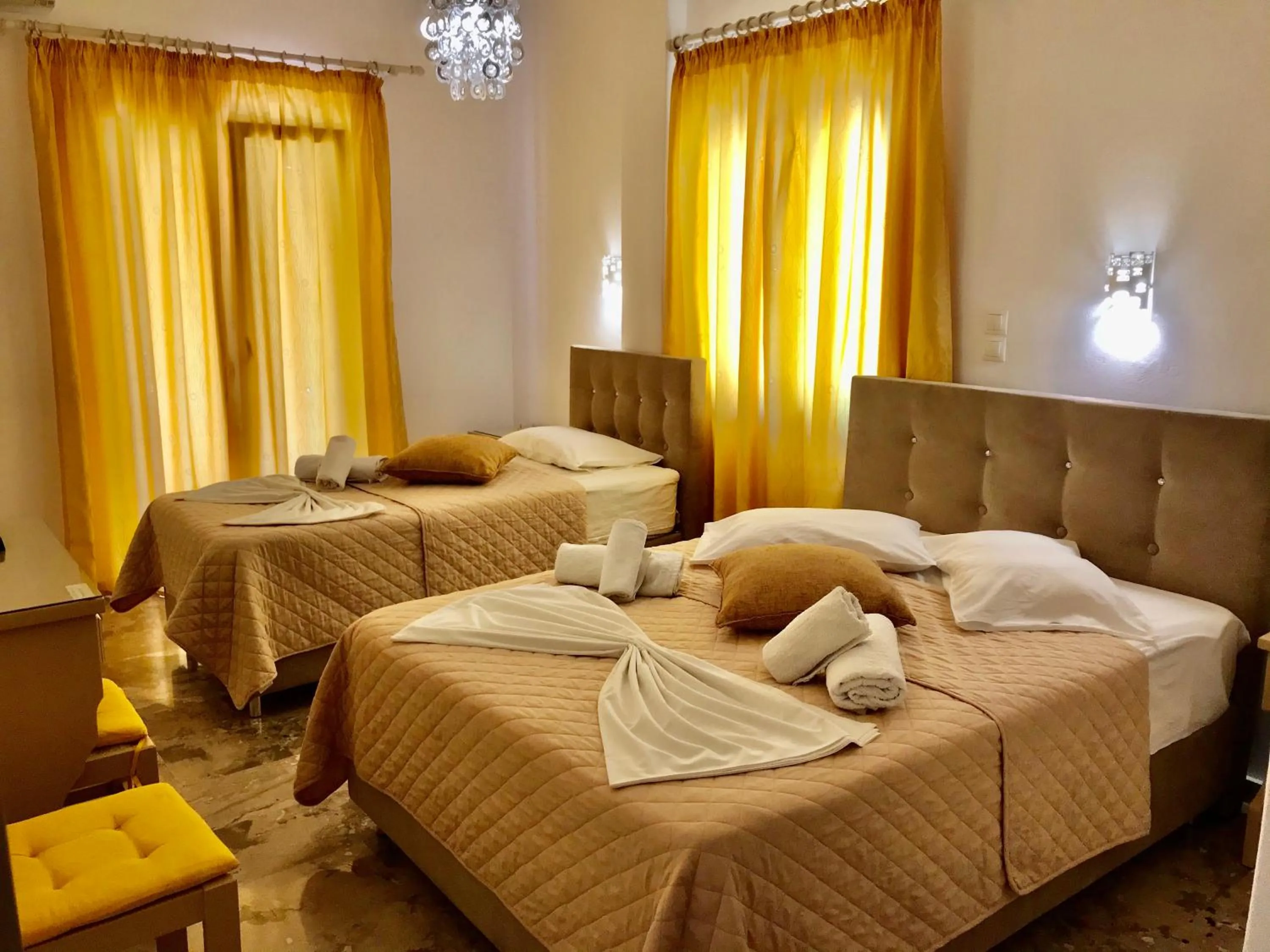 Bed in Vassiliki Rooms