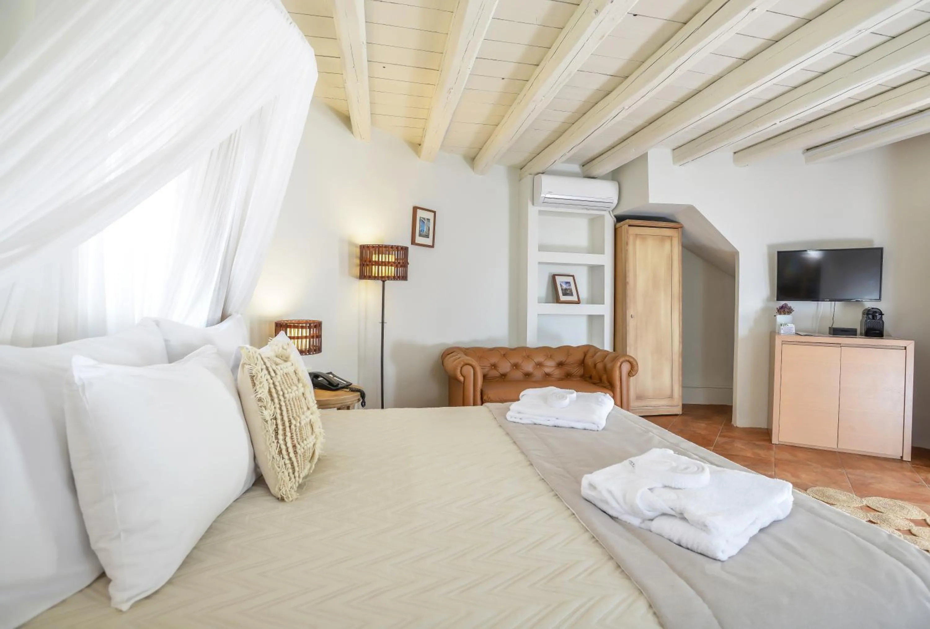 Bed in Varos Village Boutique Hotel