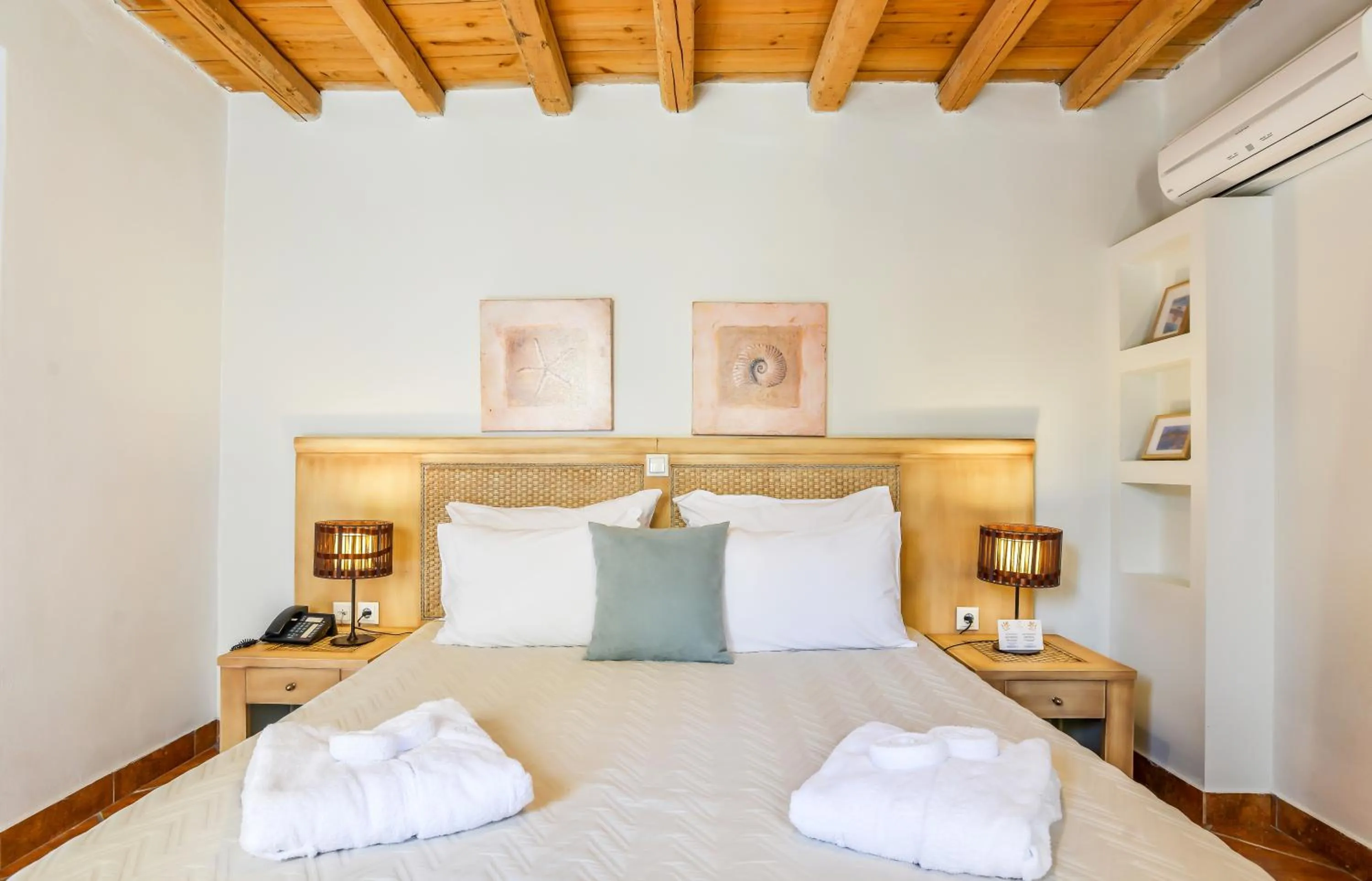 Bed in Varos Village Boutique Hotel