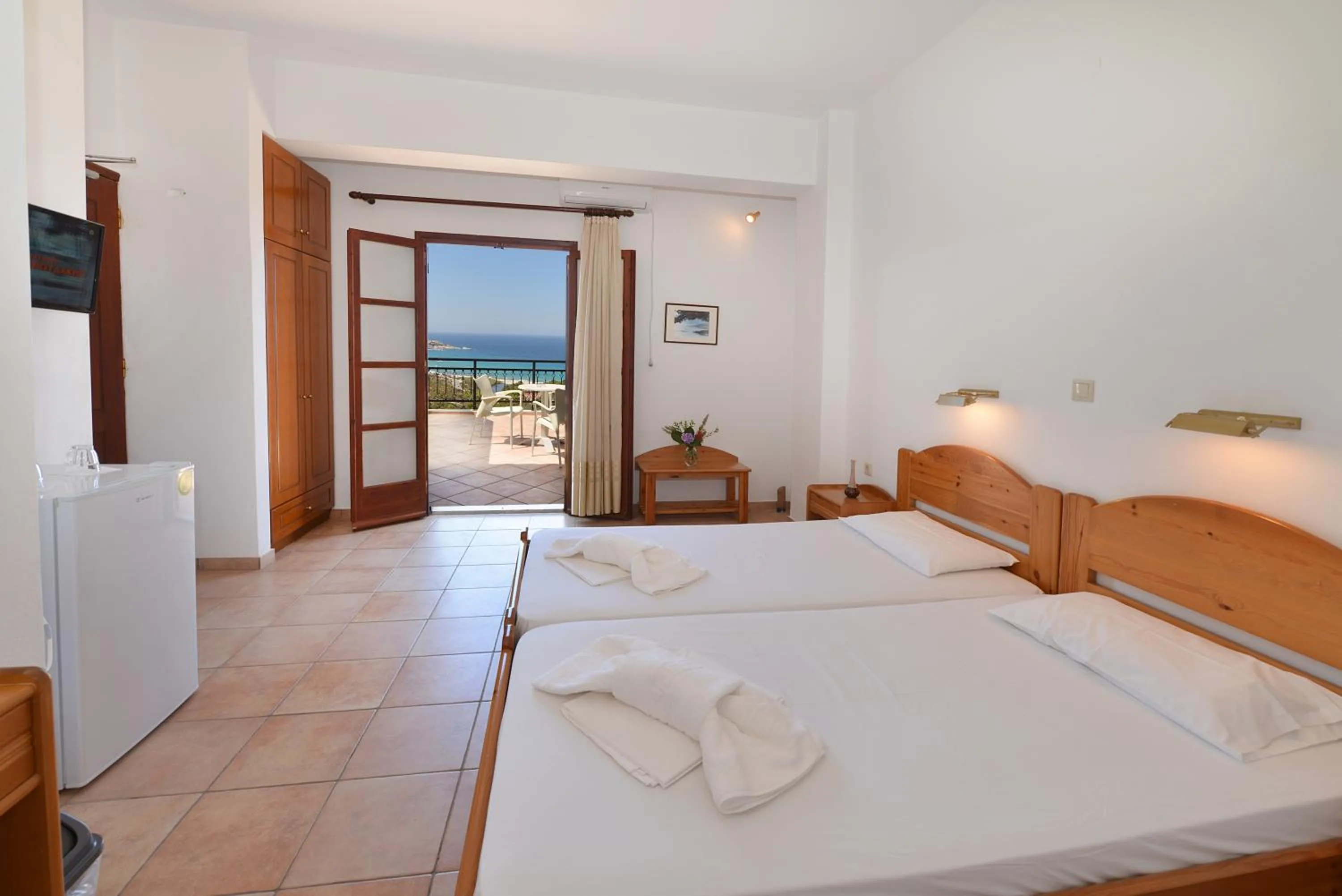 Bed in Ikaros Star Hotel