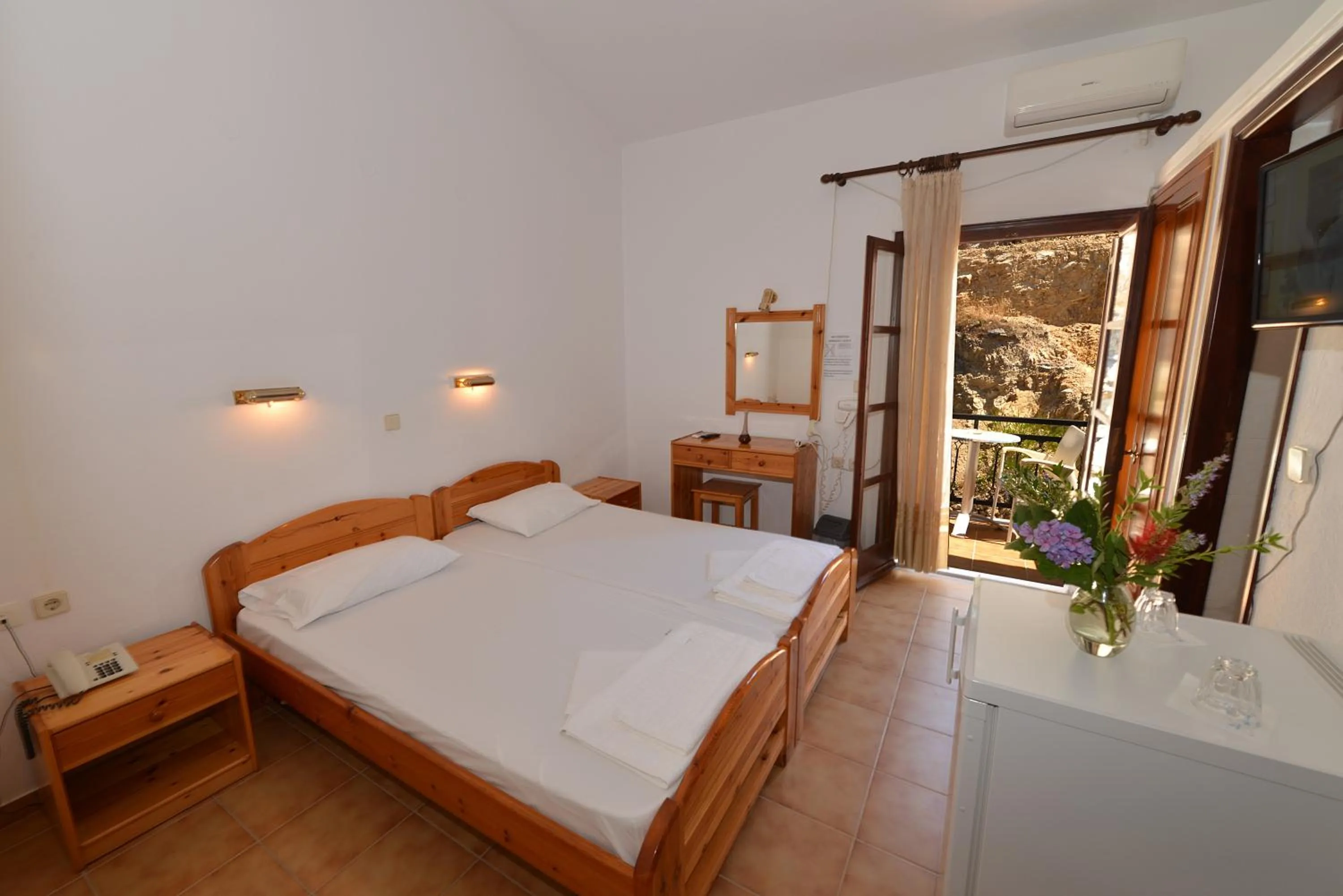 Bed in Ikaros Star Hotel