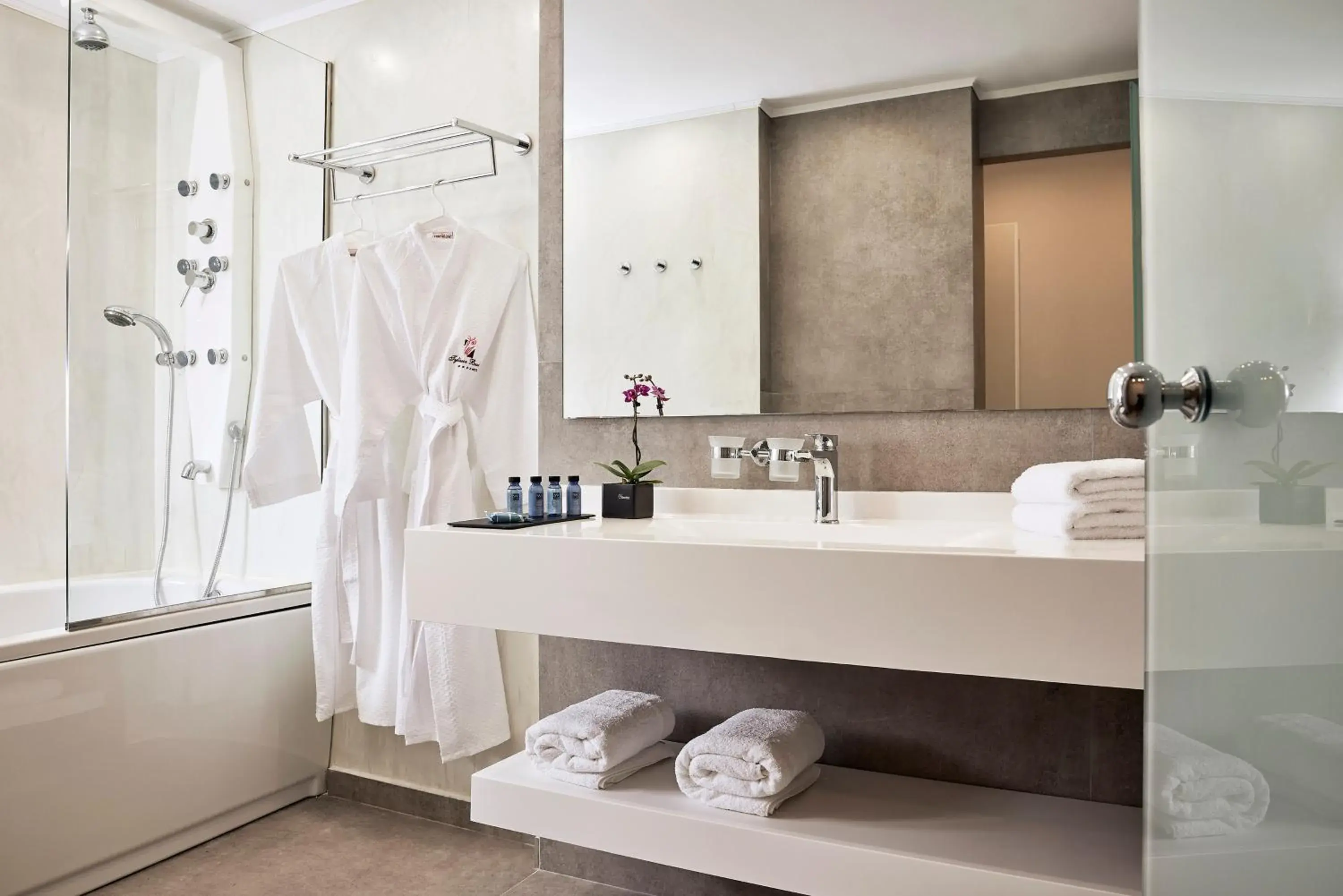 Bathroom, Bed in Tylissos Beach Hotel - Adults Only Bathroom, Bed in Tylissos Beach Hotel - Adults Only