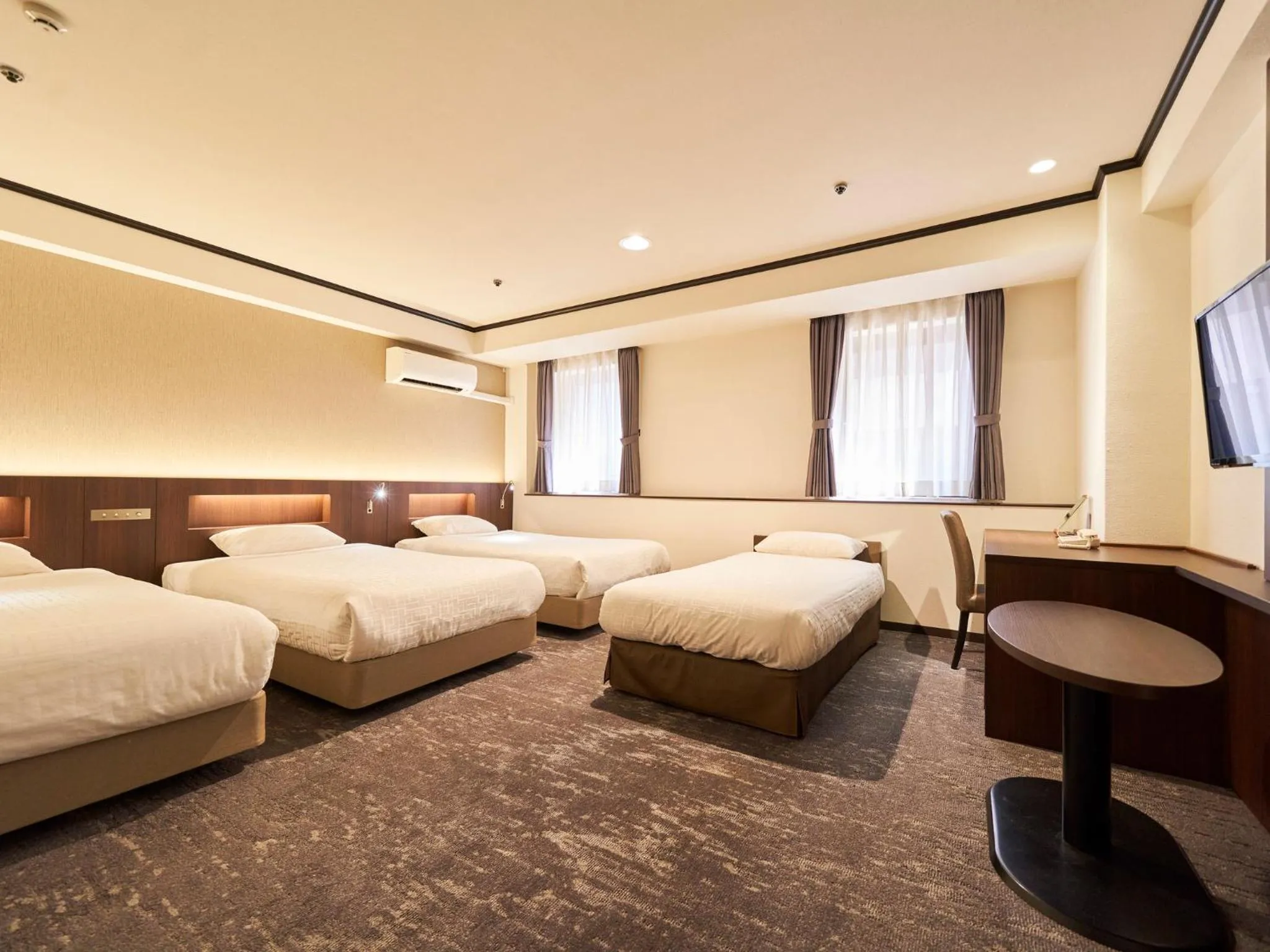 Bed in Princess Garden Hotel