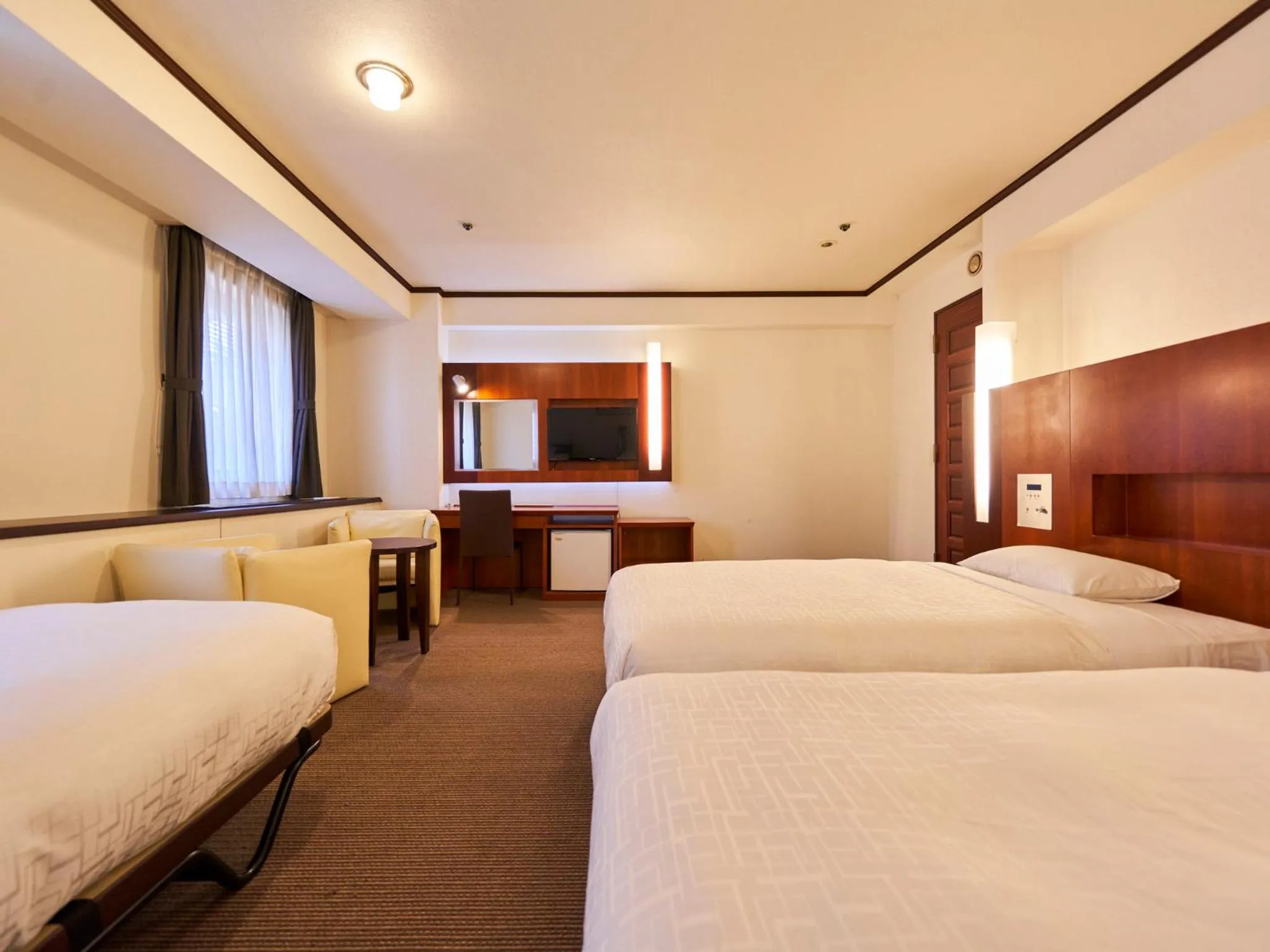 Bed in Princess Garden Hotel