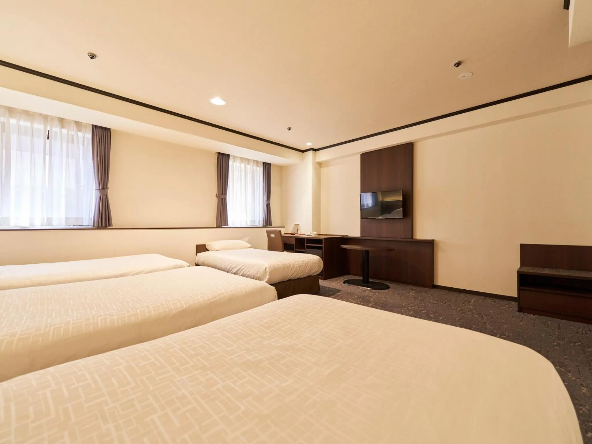 Bed in Princess Garden Hotel