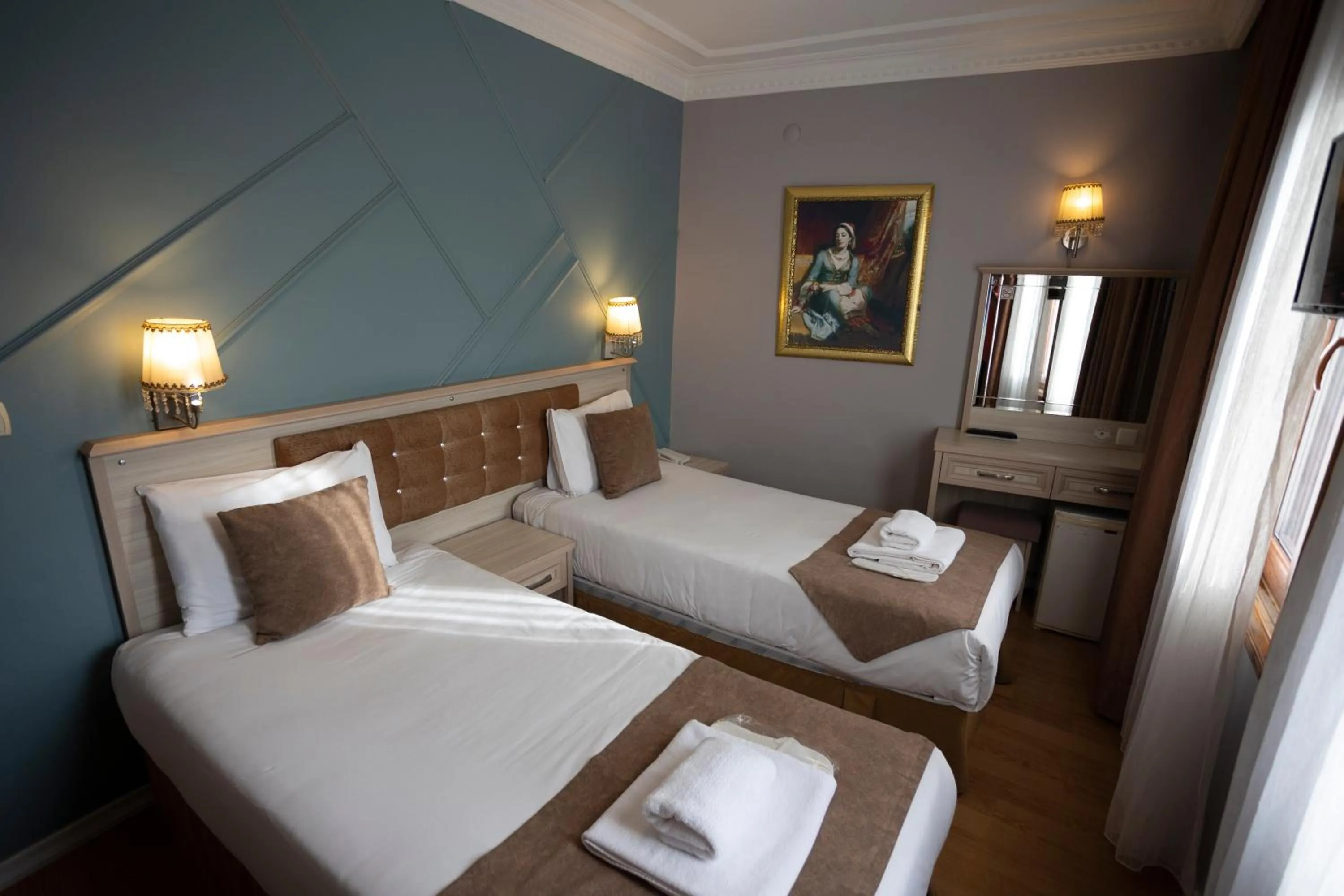 Bed in Tashkonak Studio Suites