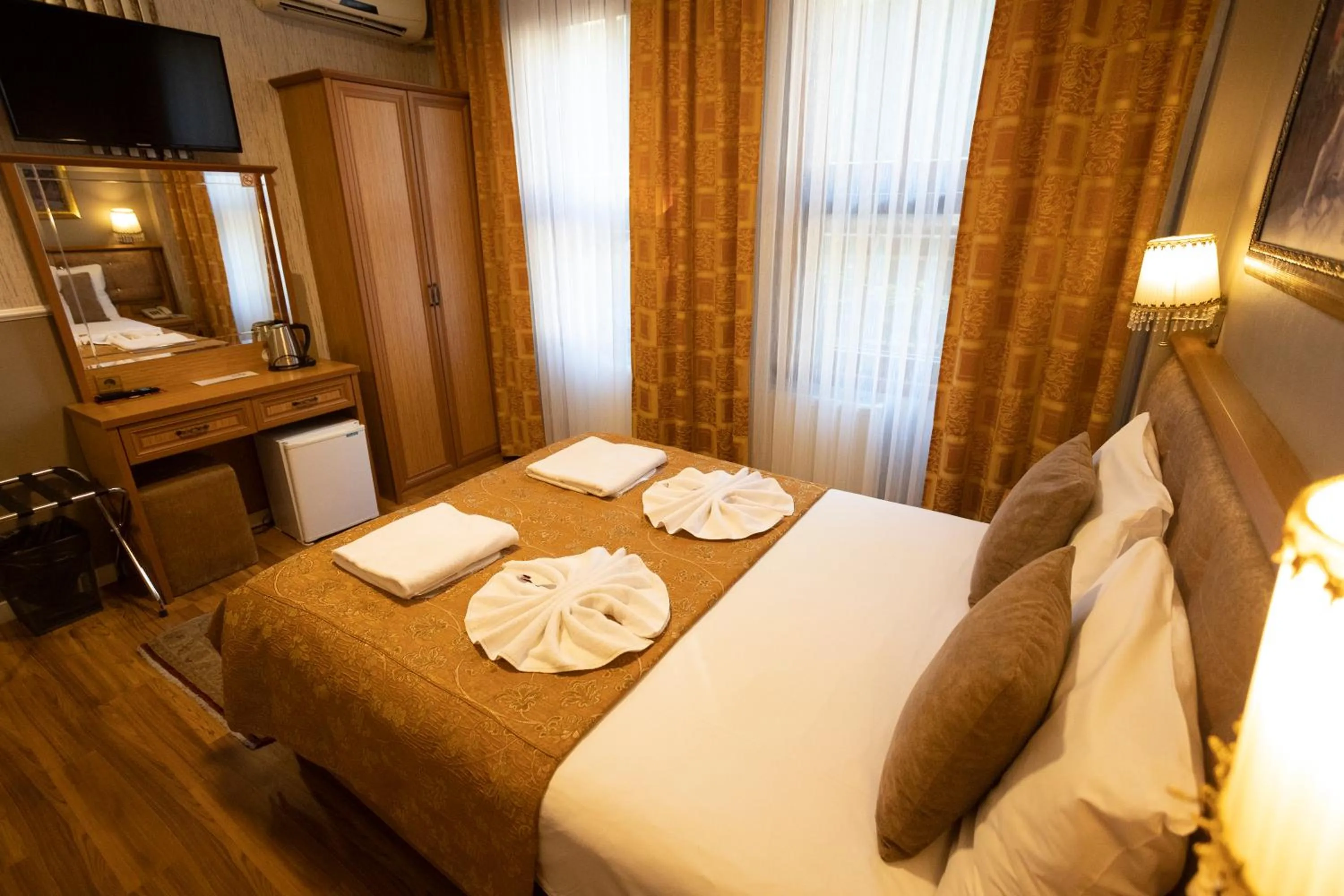 Bed in Tashkonak Studio Suites