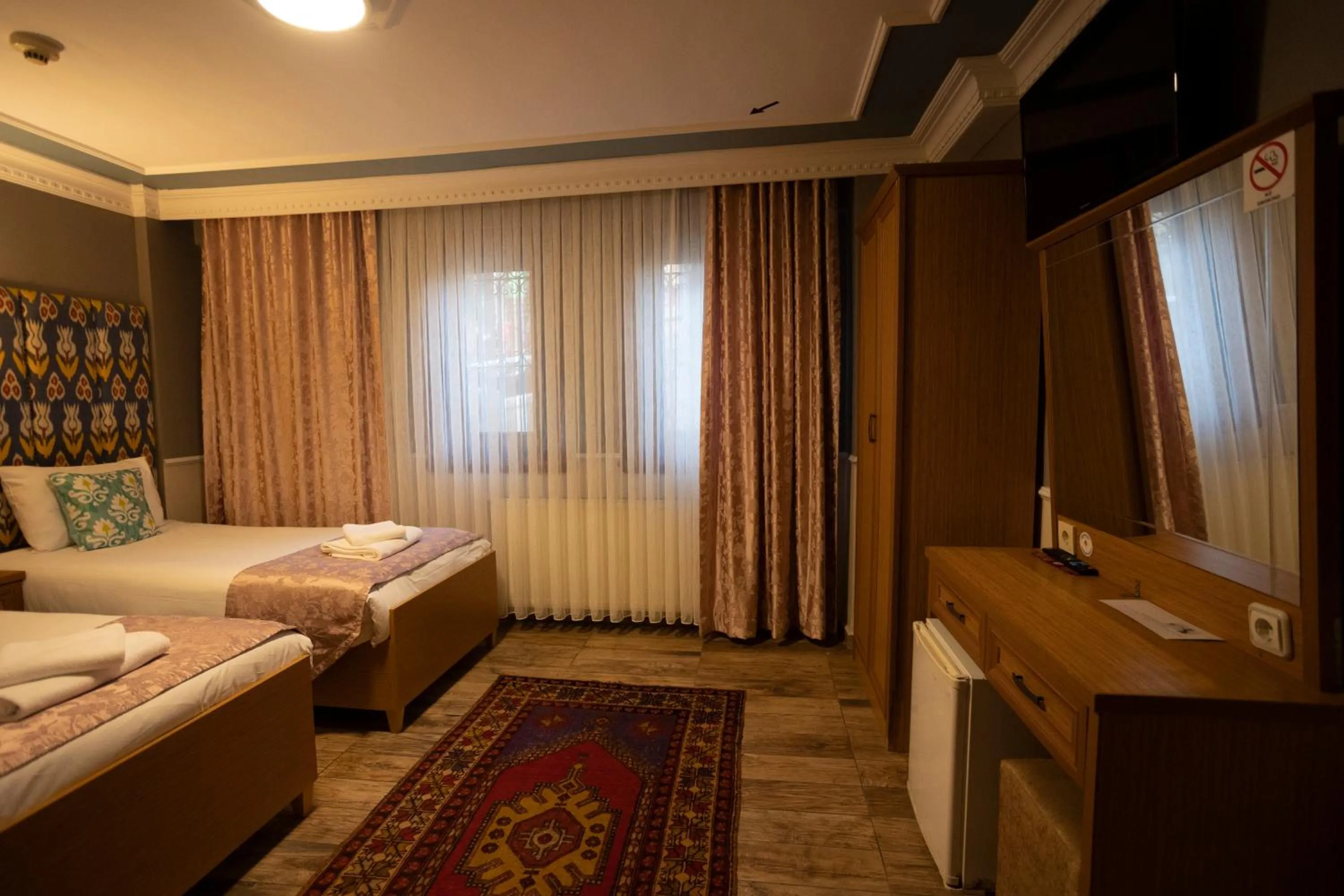 Bed in Tashkonak Studio Suites