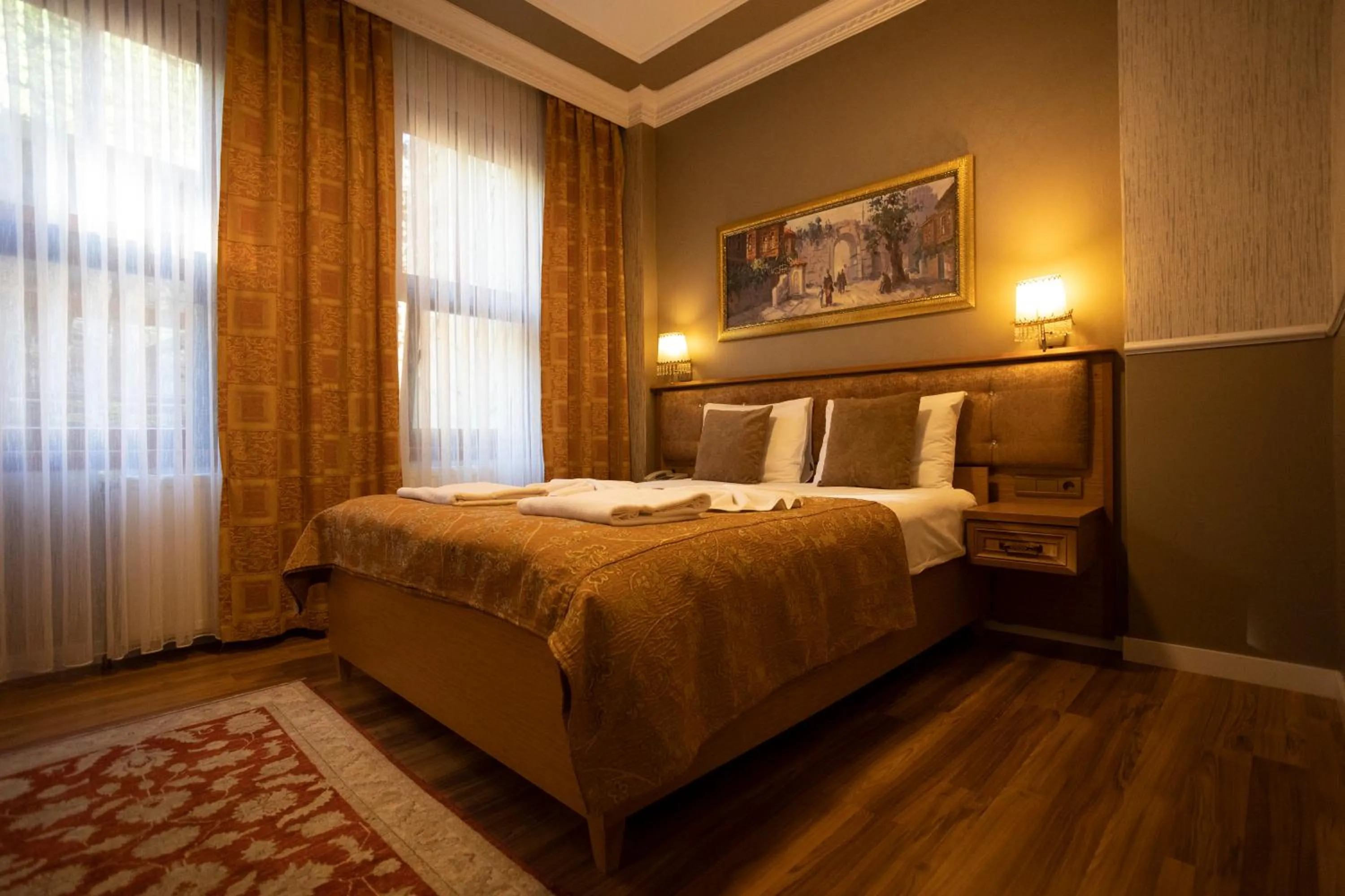 Bed in Tashkonak Studio Suites