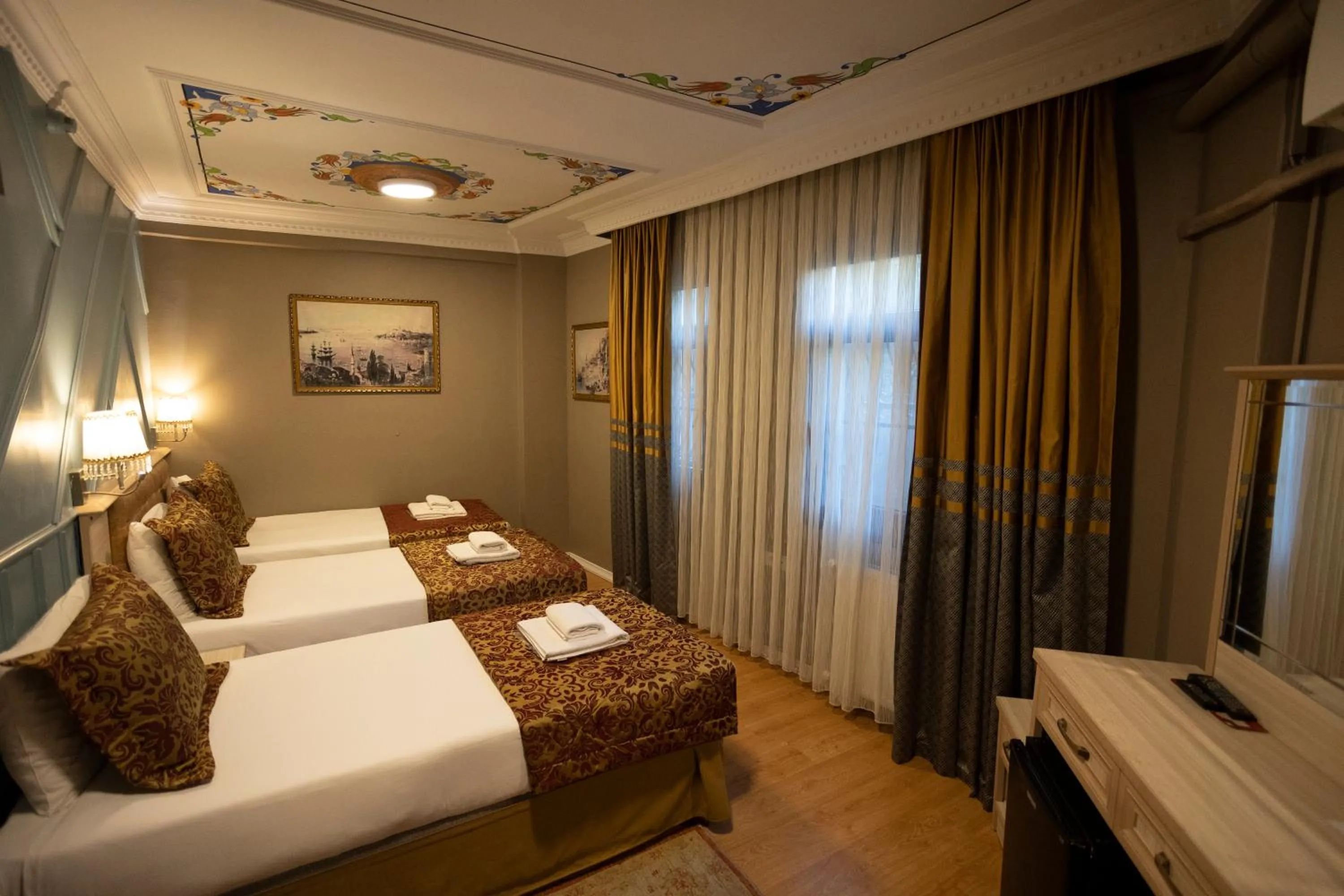 Bed in Tashkonak Studio Suites