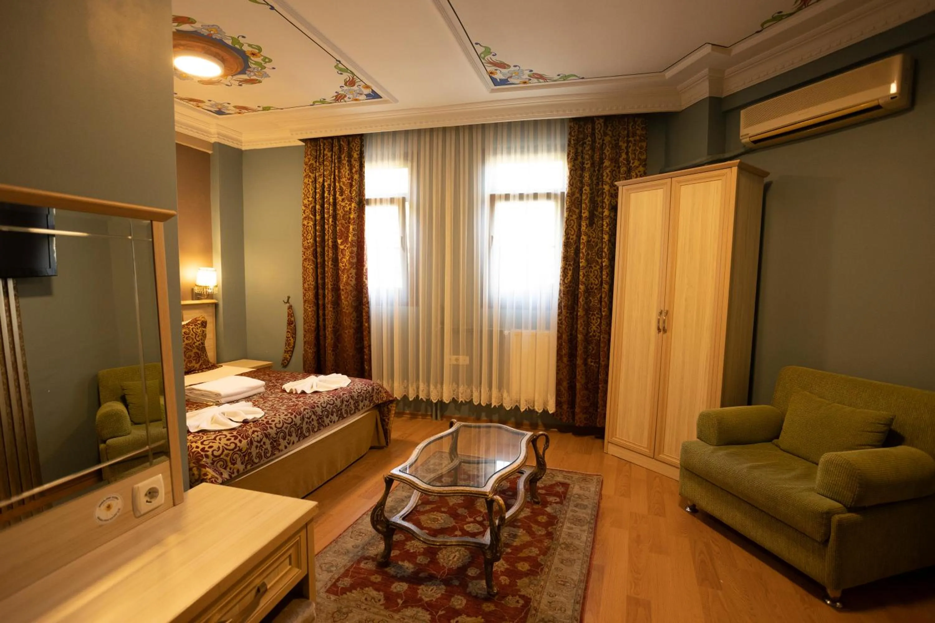 Bed in Tashkonak Studio Suites