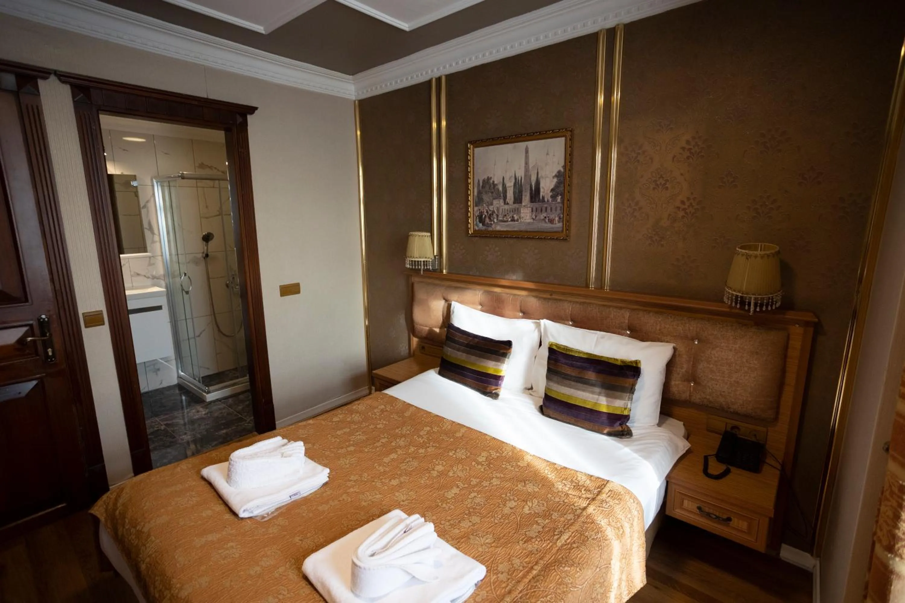 Bed in Tashkonak Studio Suites