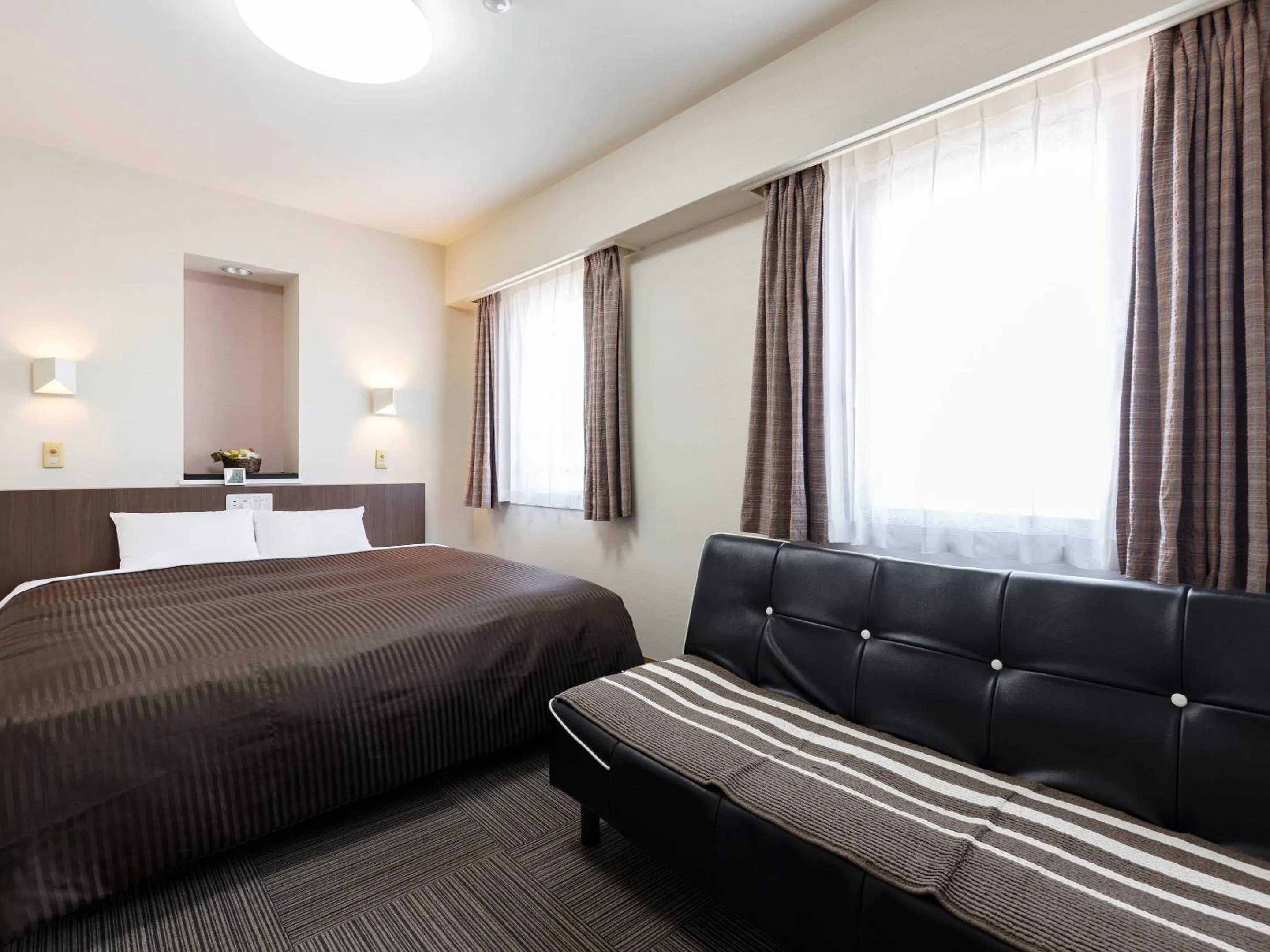 Photo of the whole room, Bed in KOKO STAY Izumi - formerly Hotel Wing International Izumi
