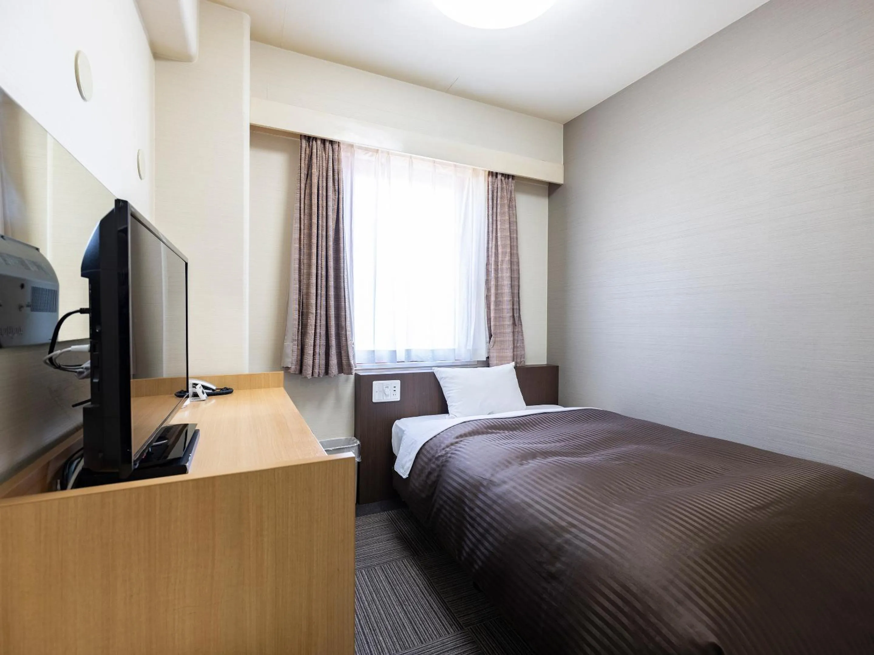 Photo of the whole room, Bed in KOKO STAY Izumi - formerly Hotel Wing International Izumi