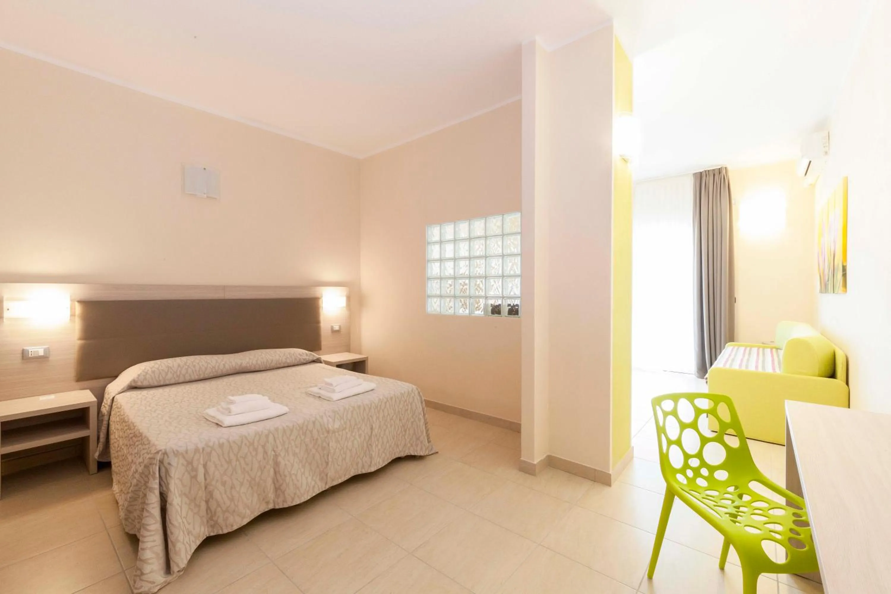 Bed in Diano Sporting Apartments