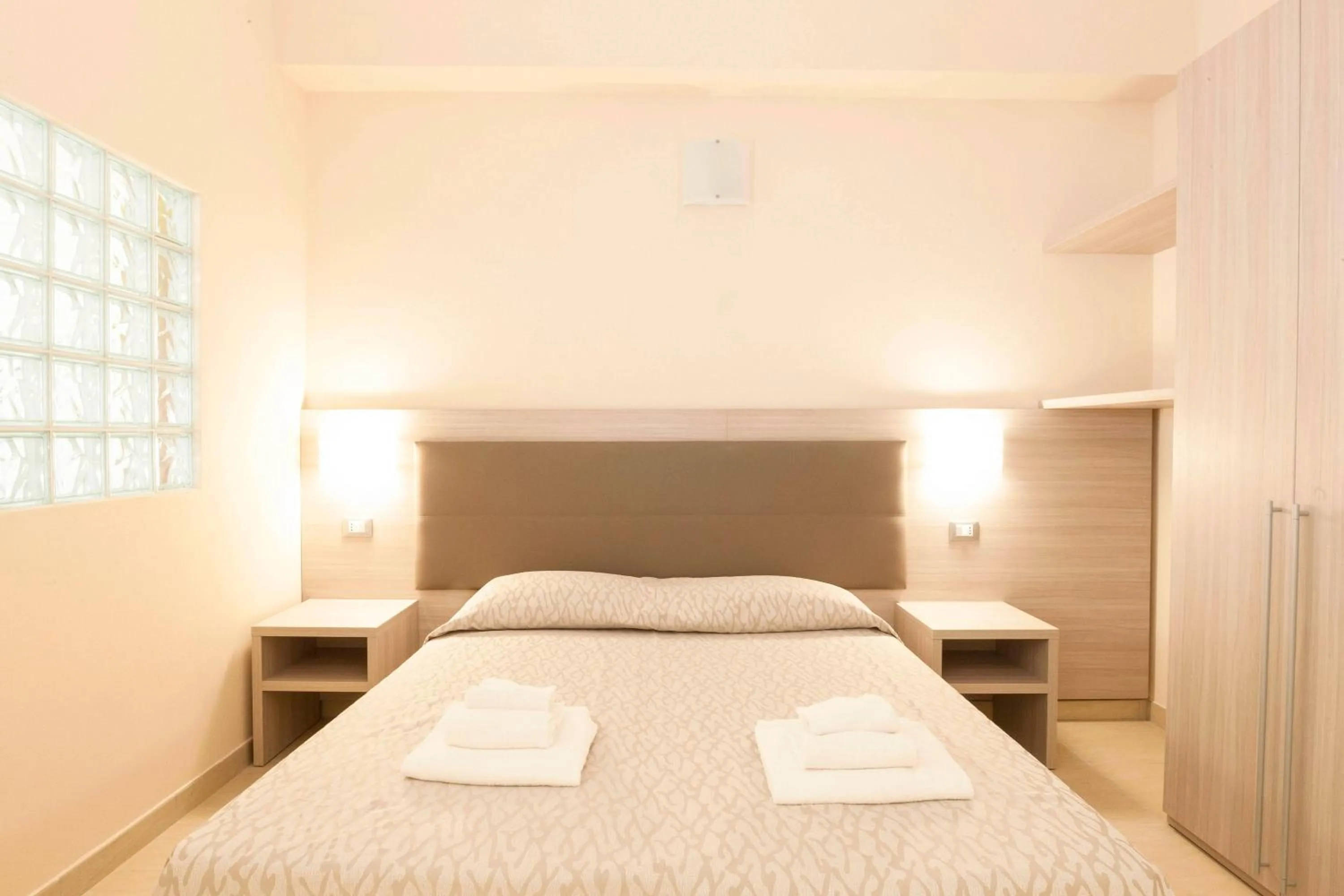Bed in Diano Sporting Apartments