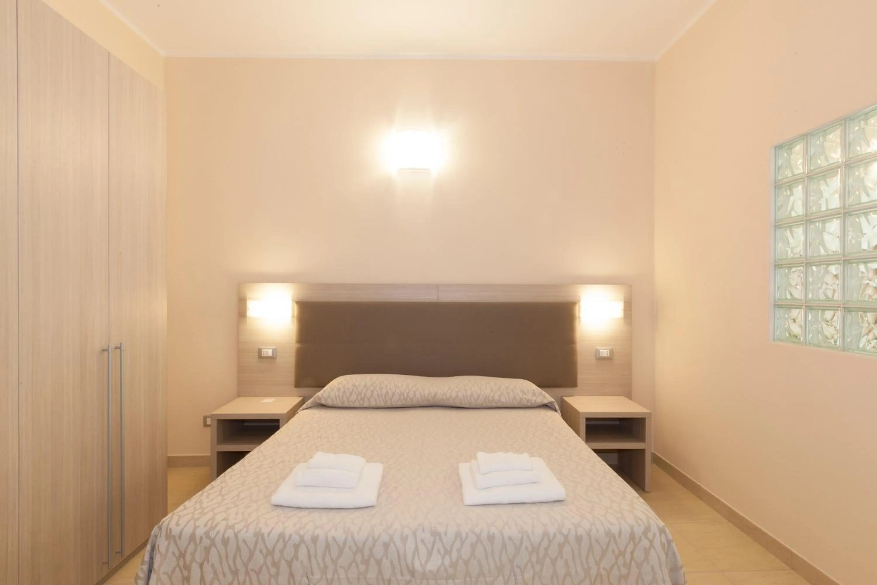 Bed in Diano Sporting Apartments