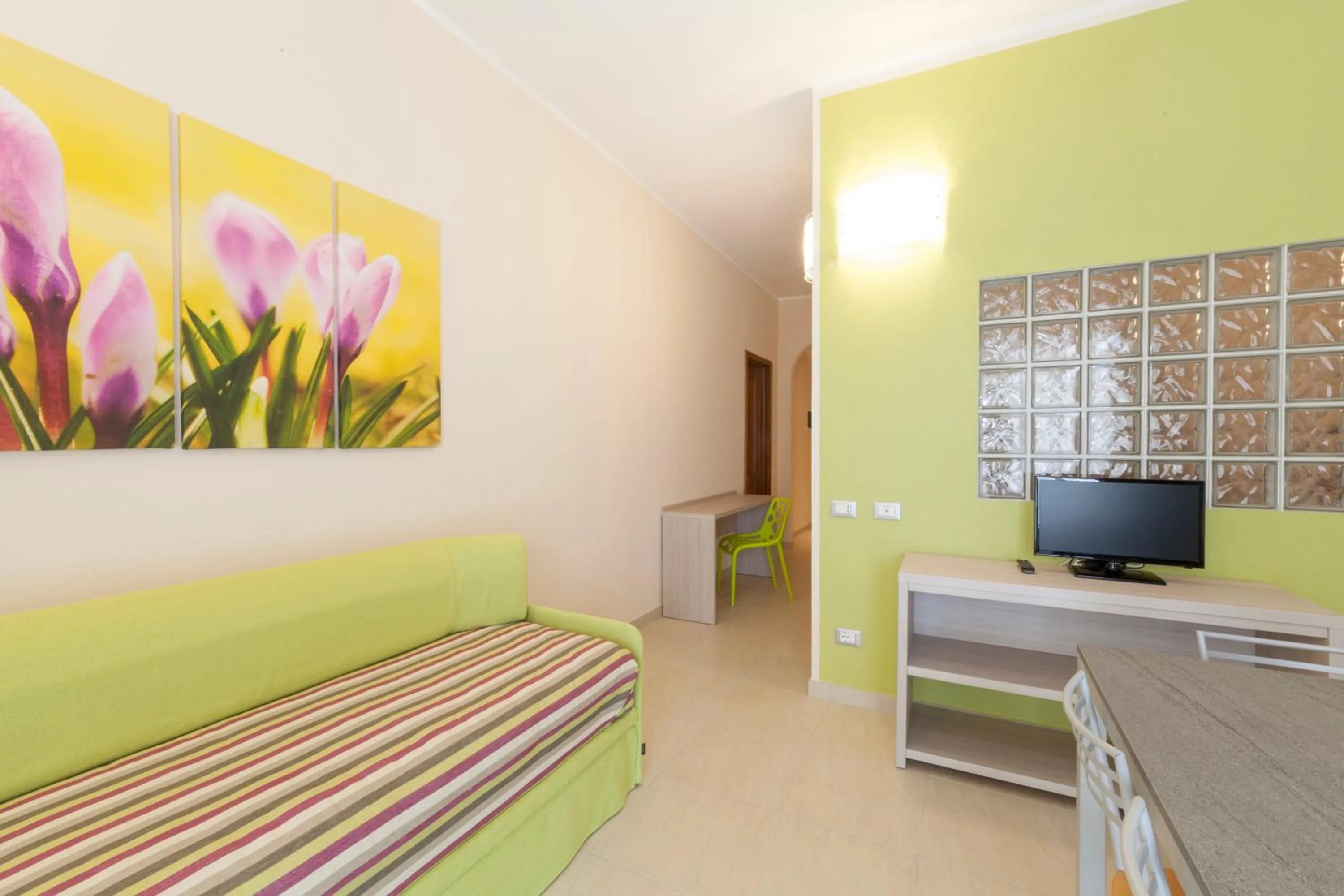 Living room, Bed in Diano Sporting Apartments