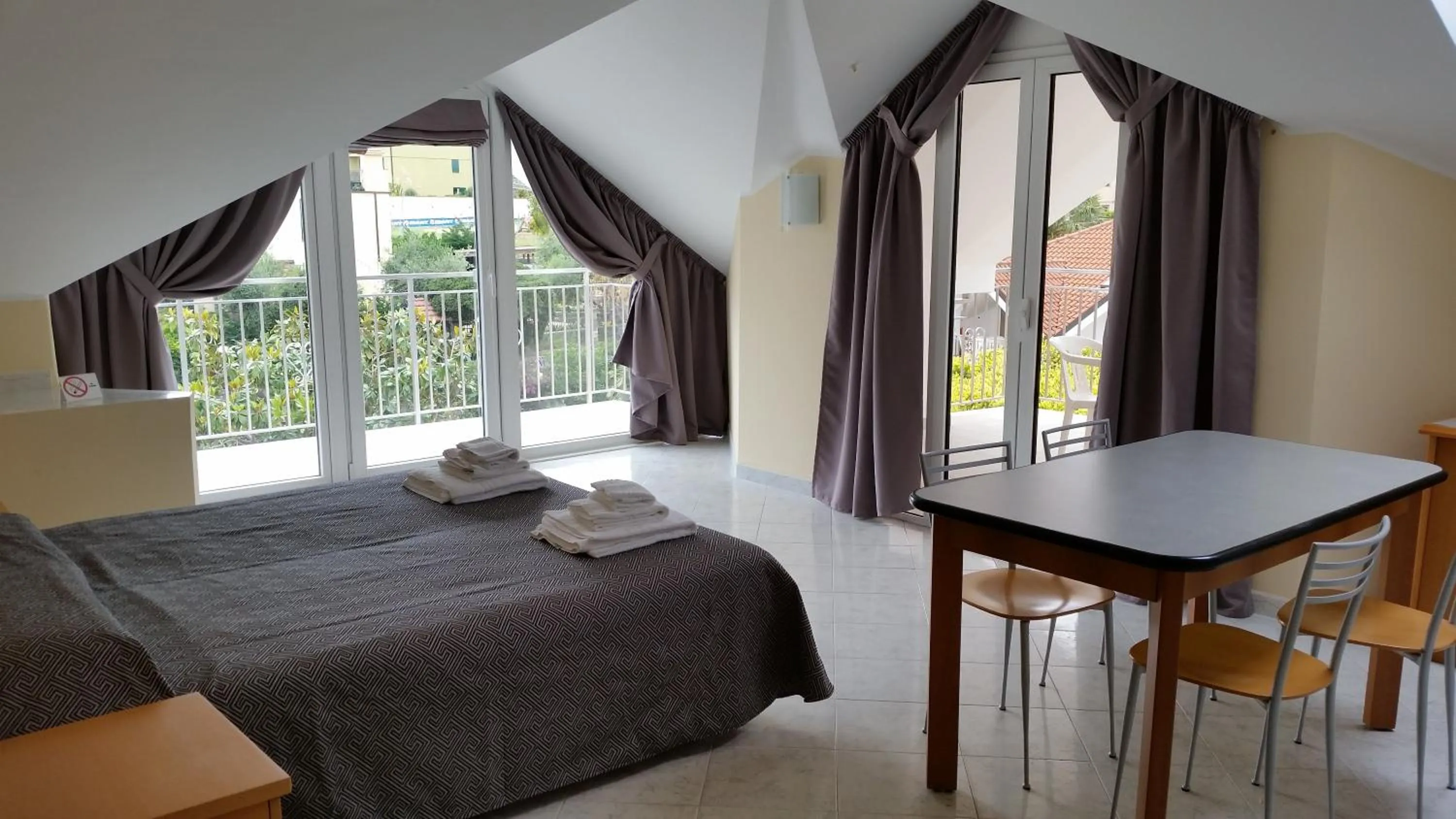 Bed in Diano Sporting Apartments