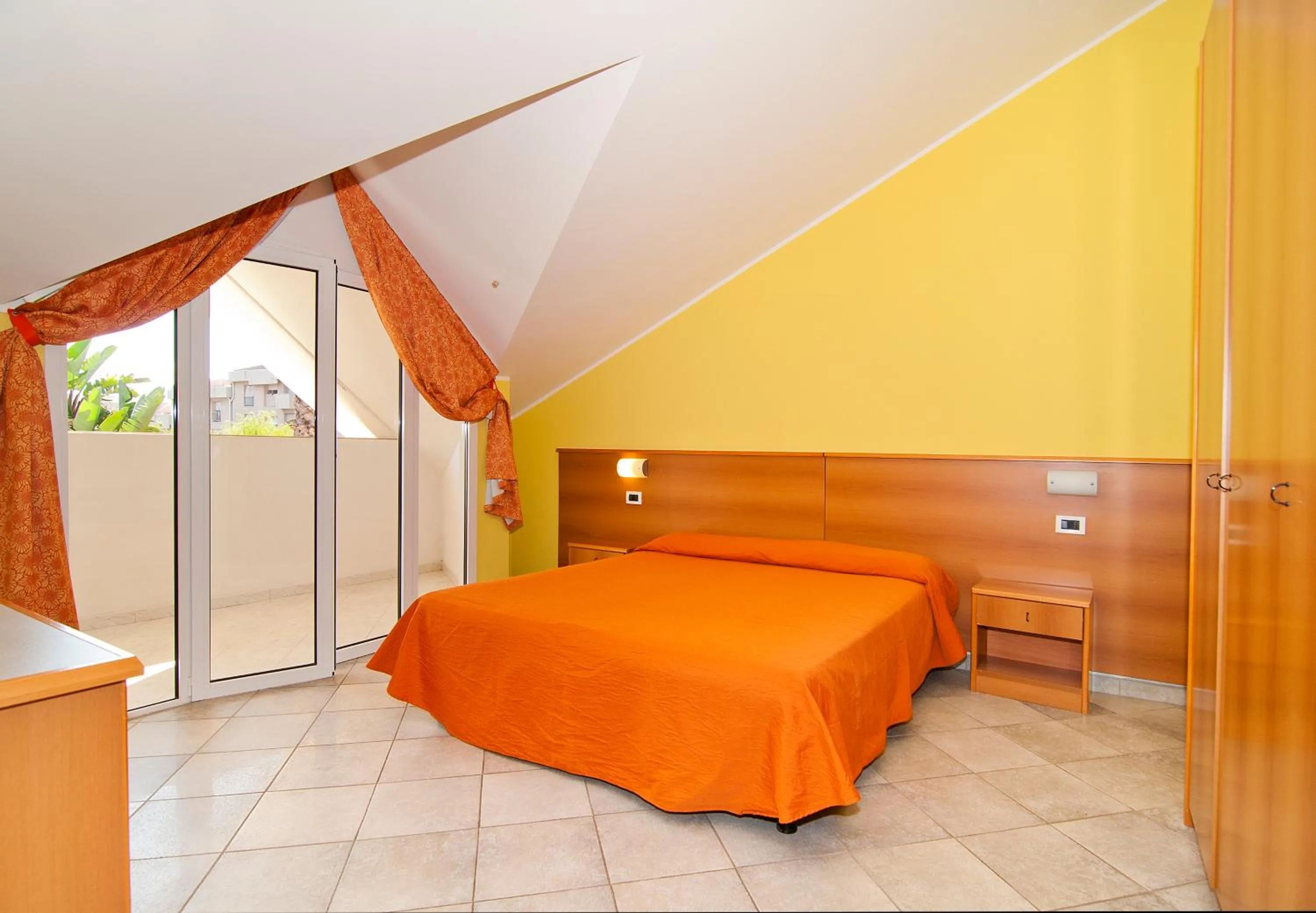Bed in Diano Sporting Apartments