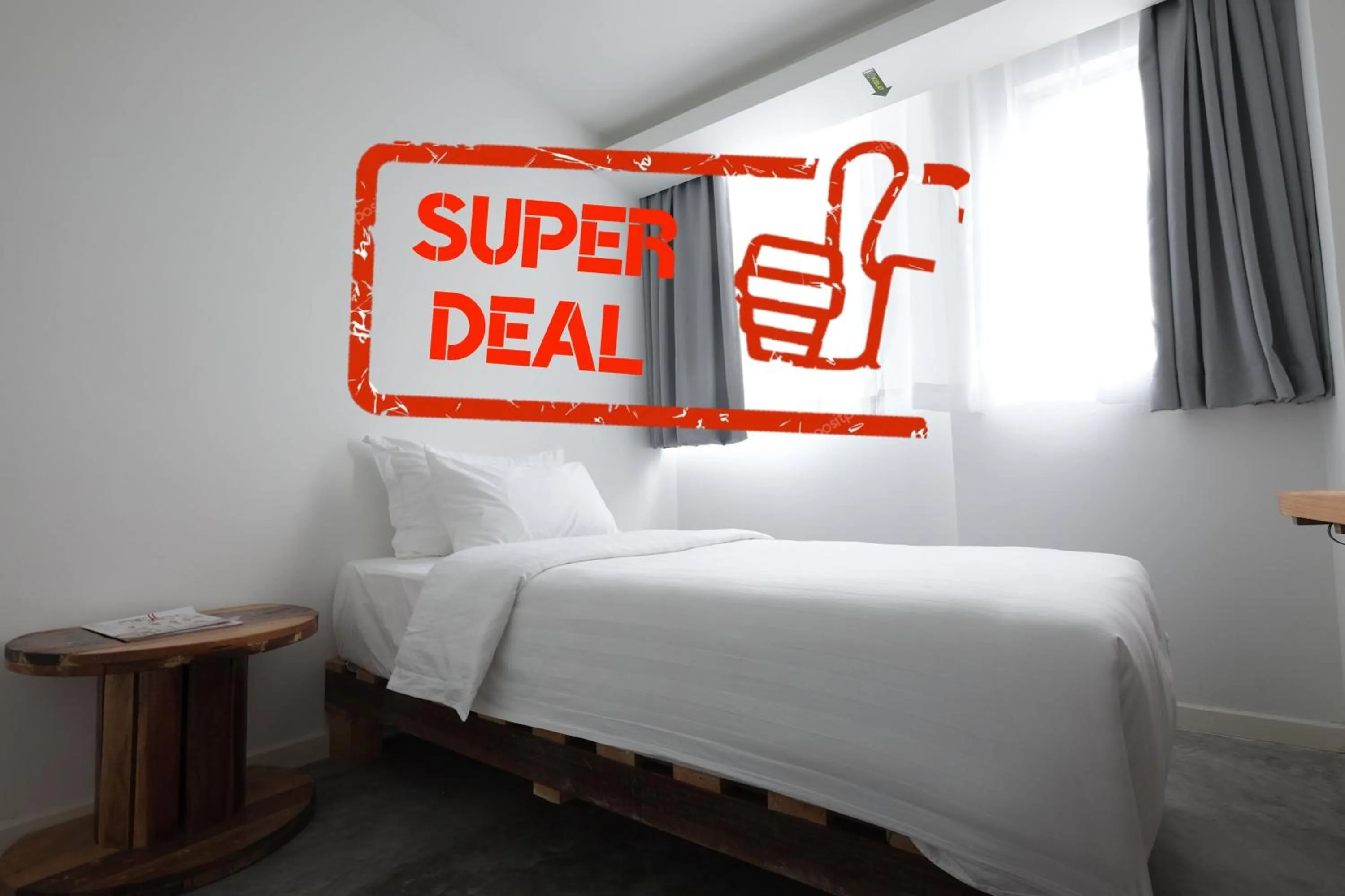 Bed in White Loft Hotel