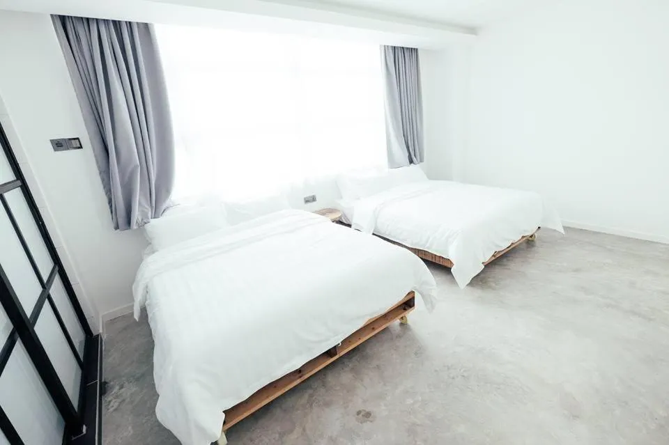 Bed in White Loft Hotel