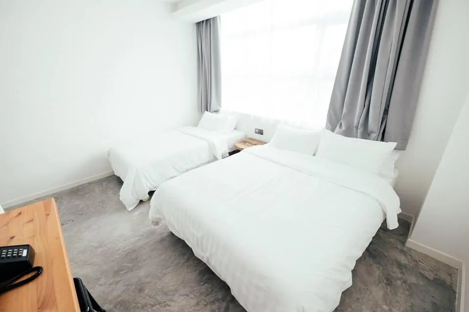 Bed in White Loft Hotel