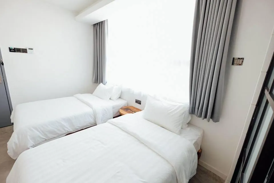 Bed in White Loft Hotel